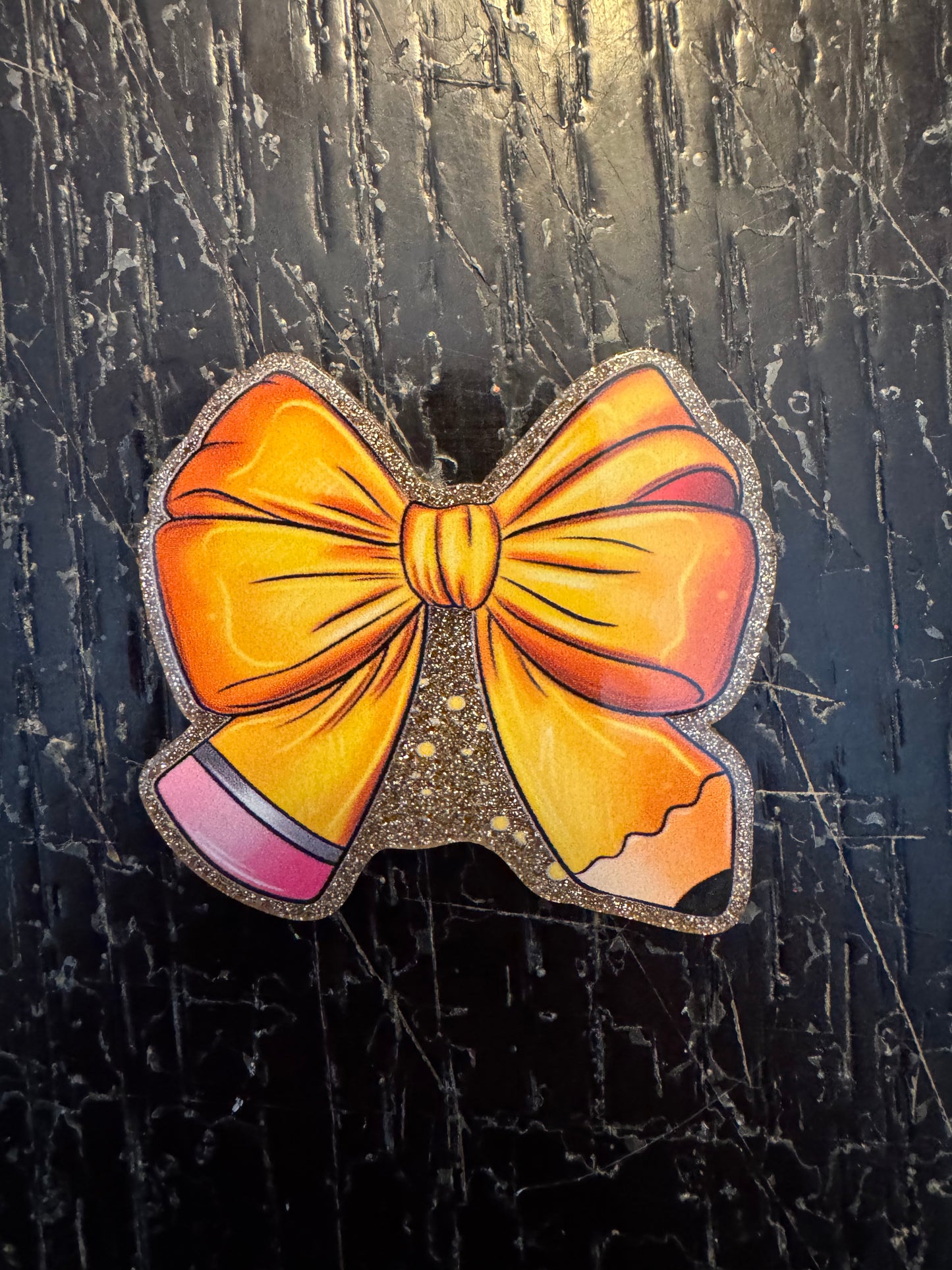 Pencil bow badge reel