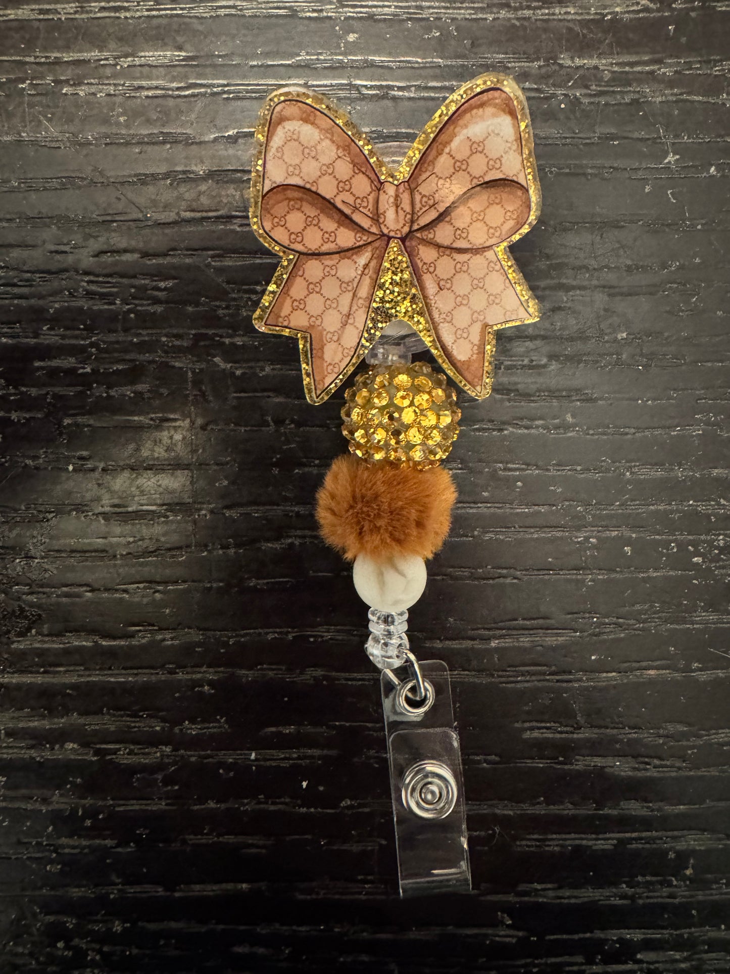 Gucci bow badge reel