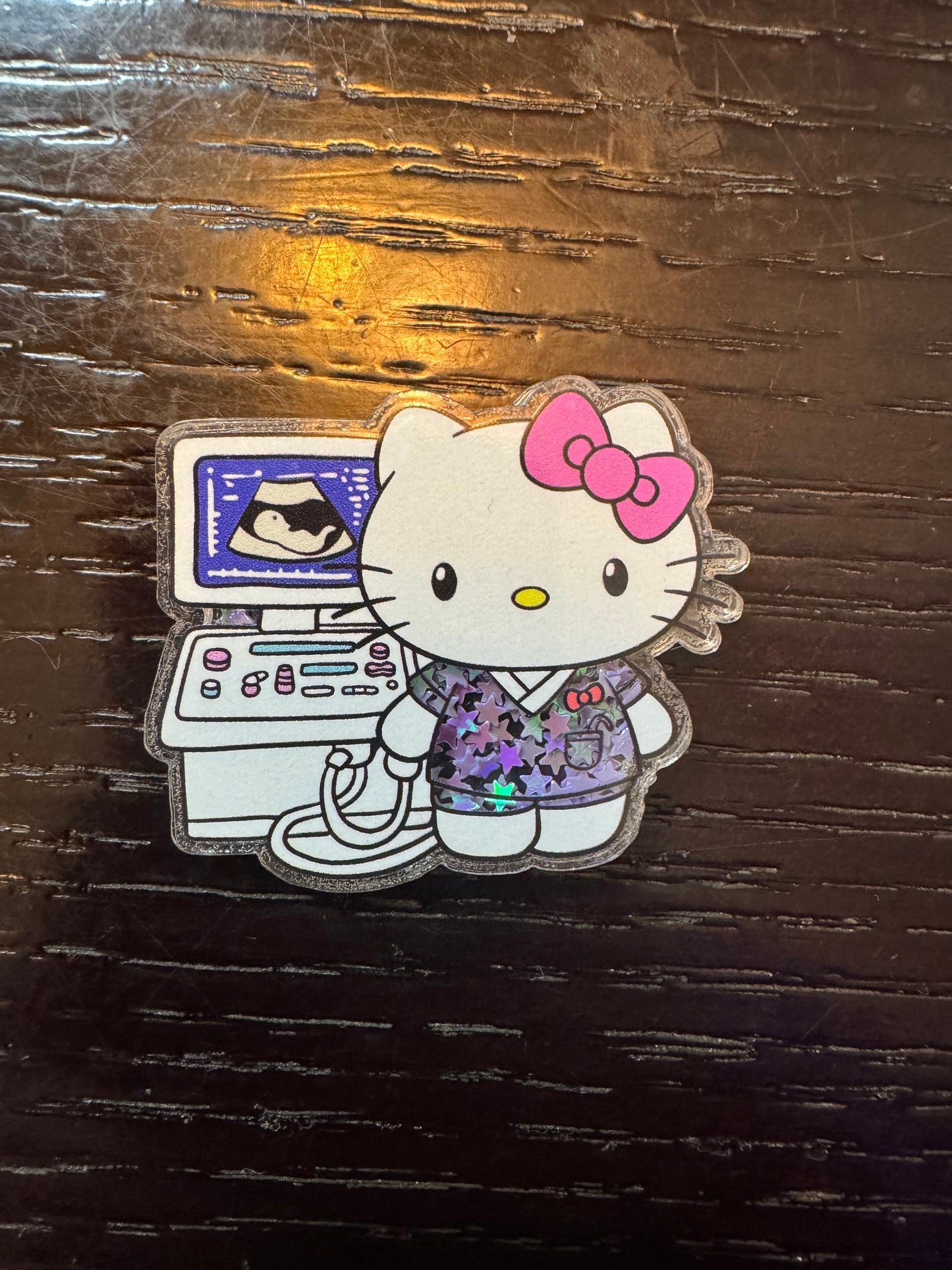 Hello Kitty ultrasound shaker badge reel