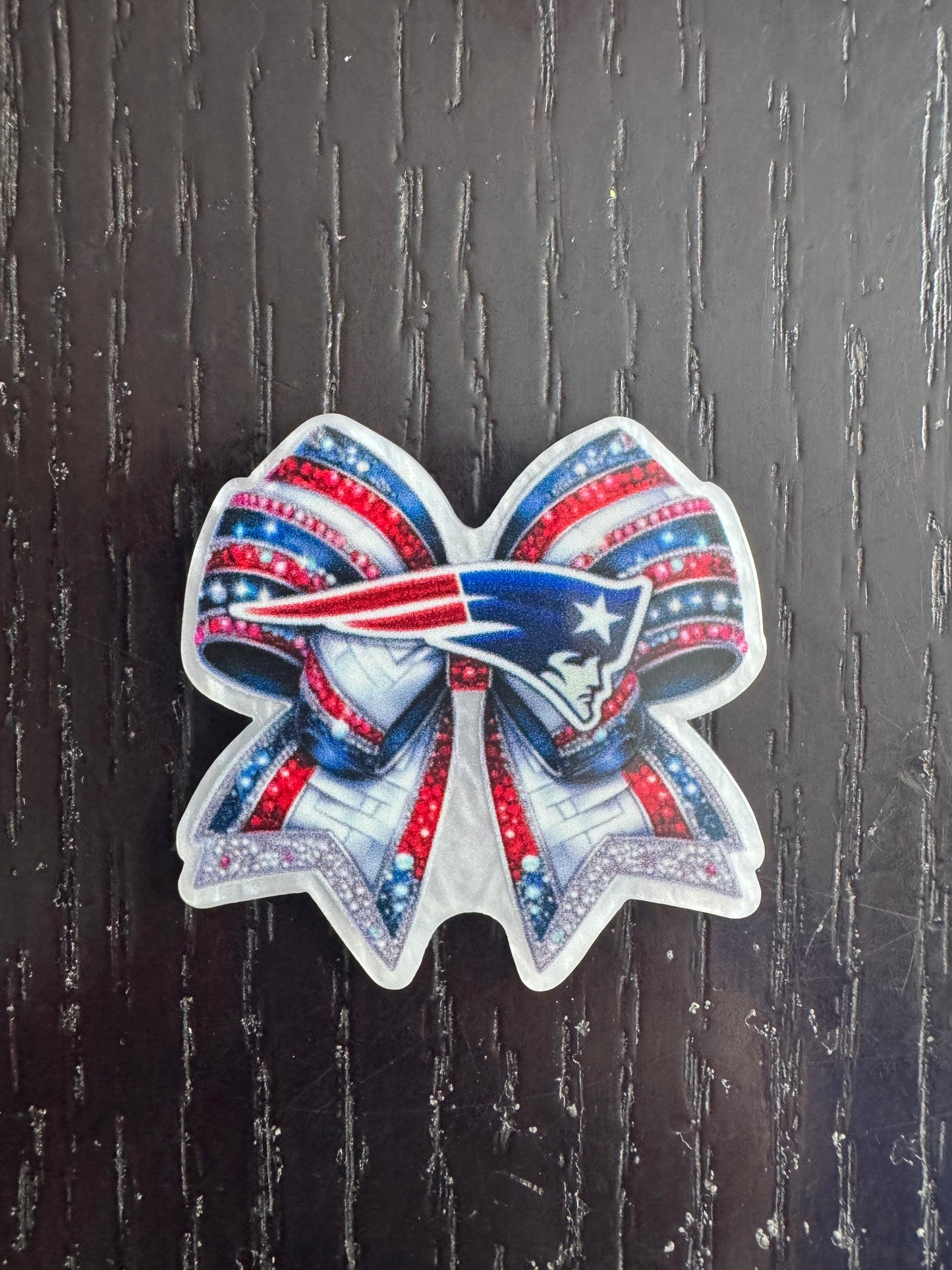 Patriots bow badge reel