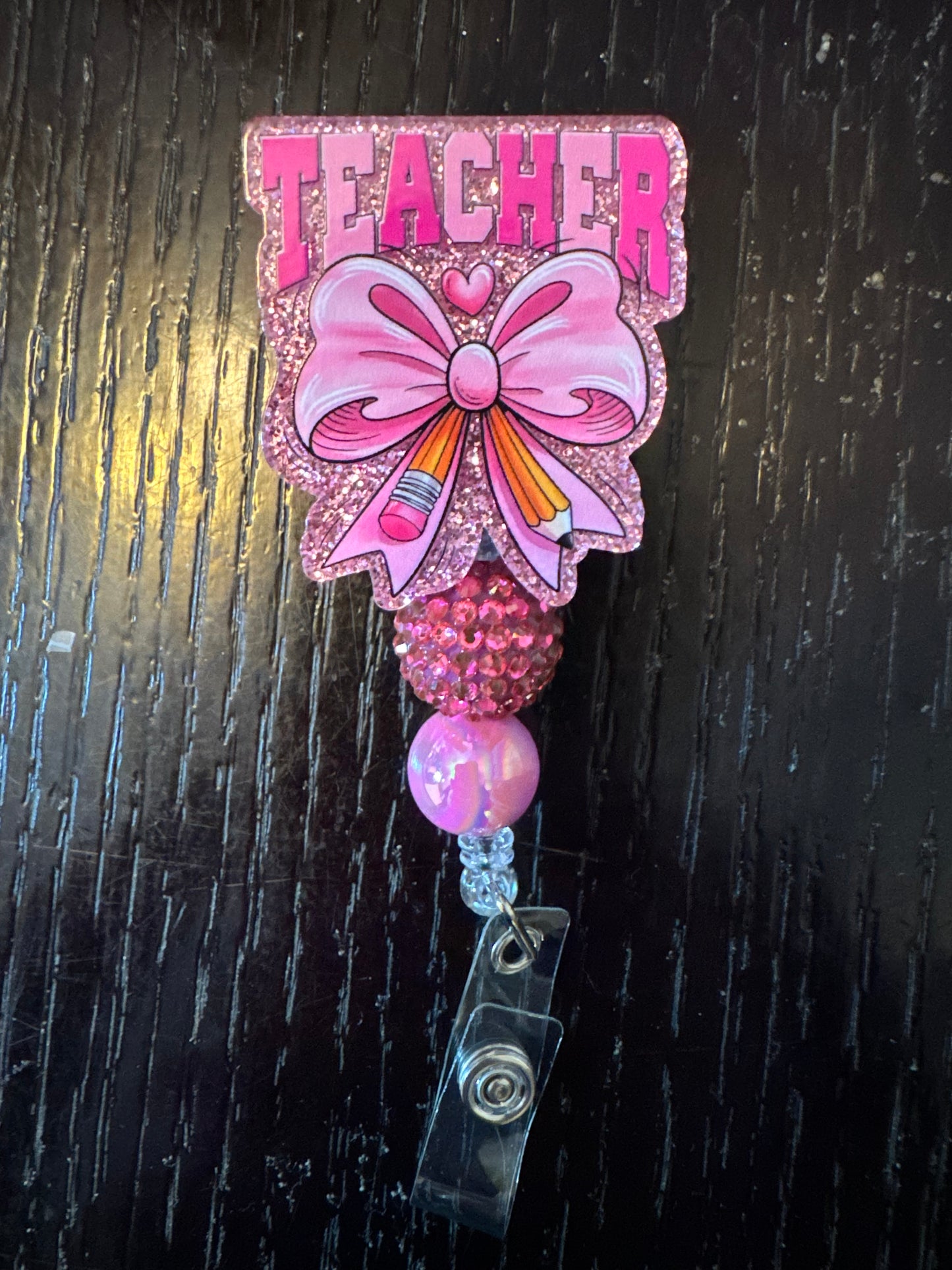 Teacher badge reel