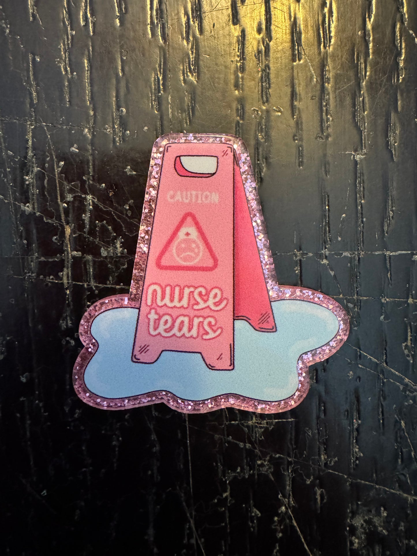 Nurse tears badge reel