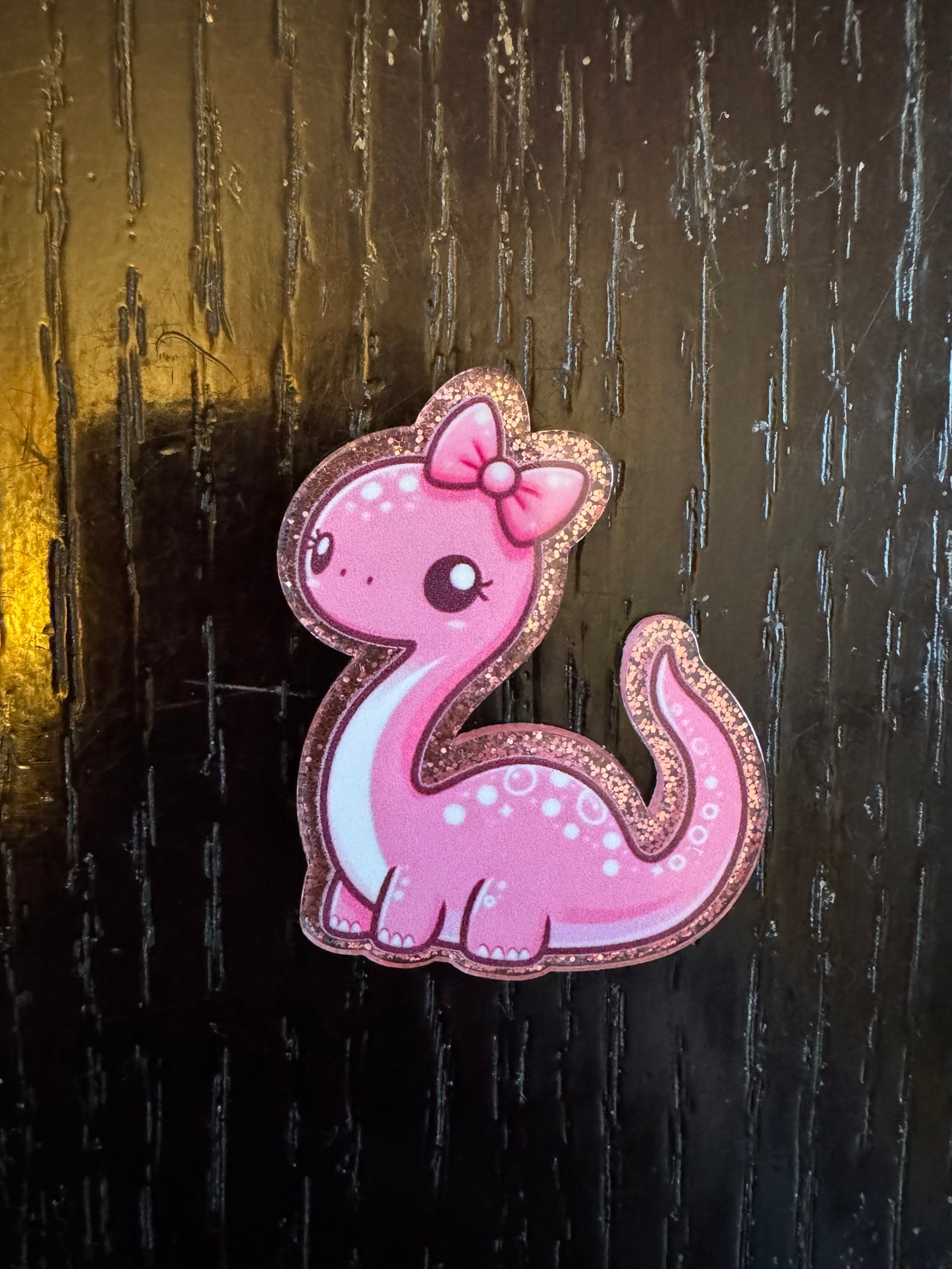 Dino badge reel