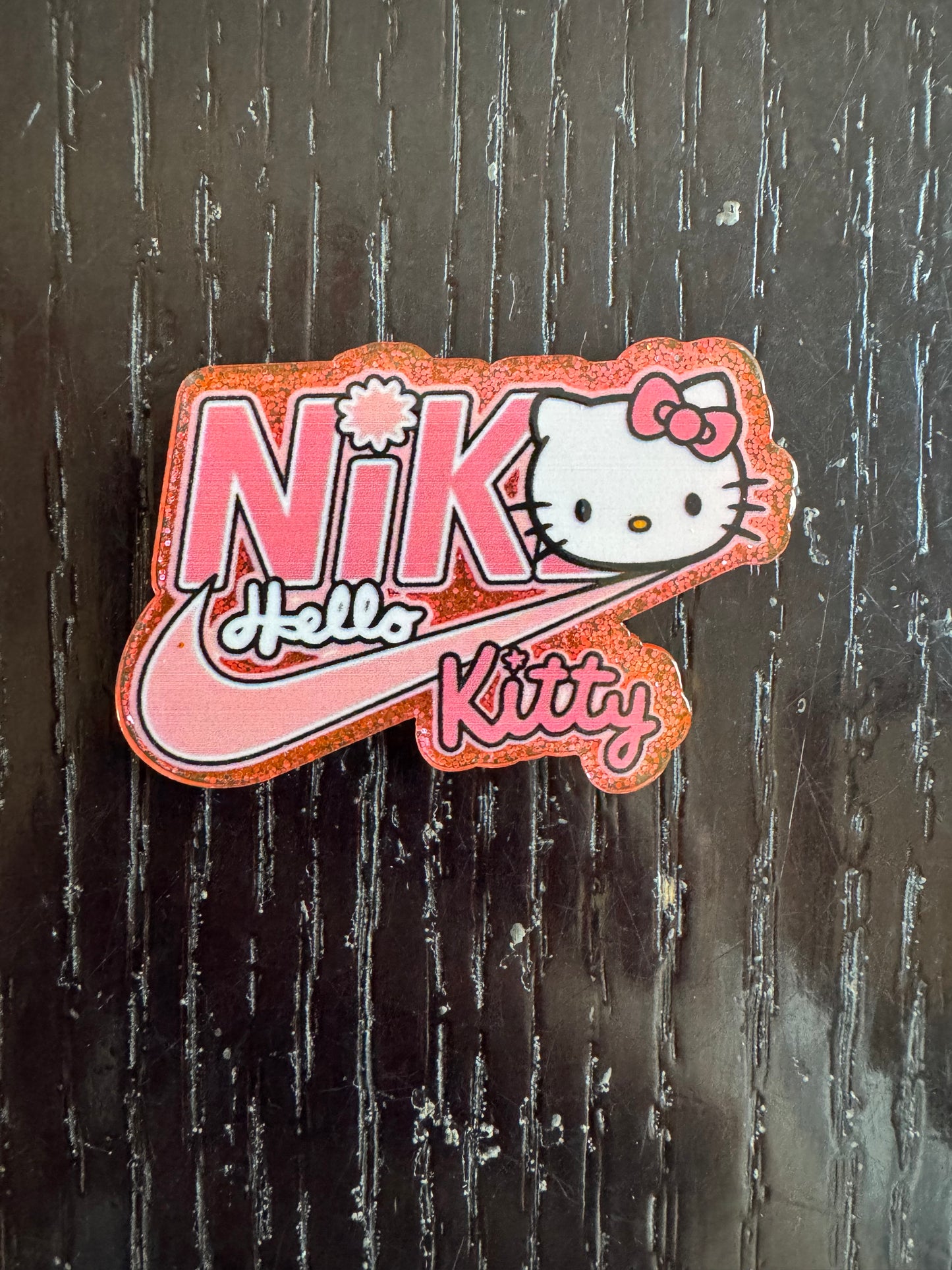 Hello Kitty Nike badge reel