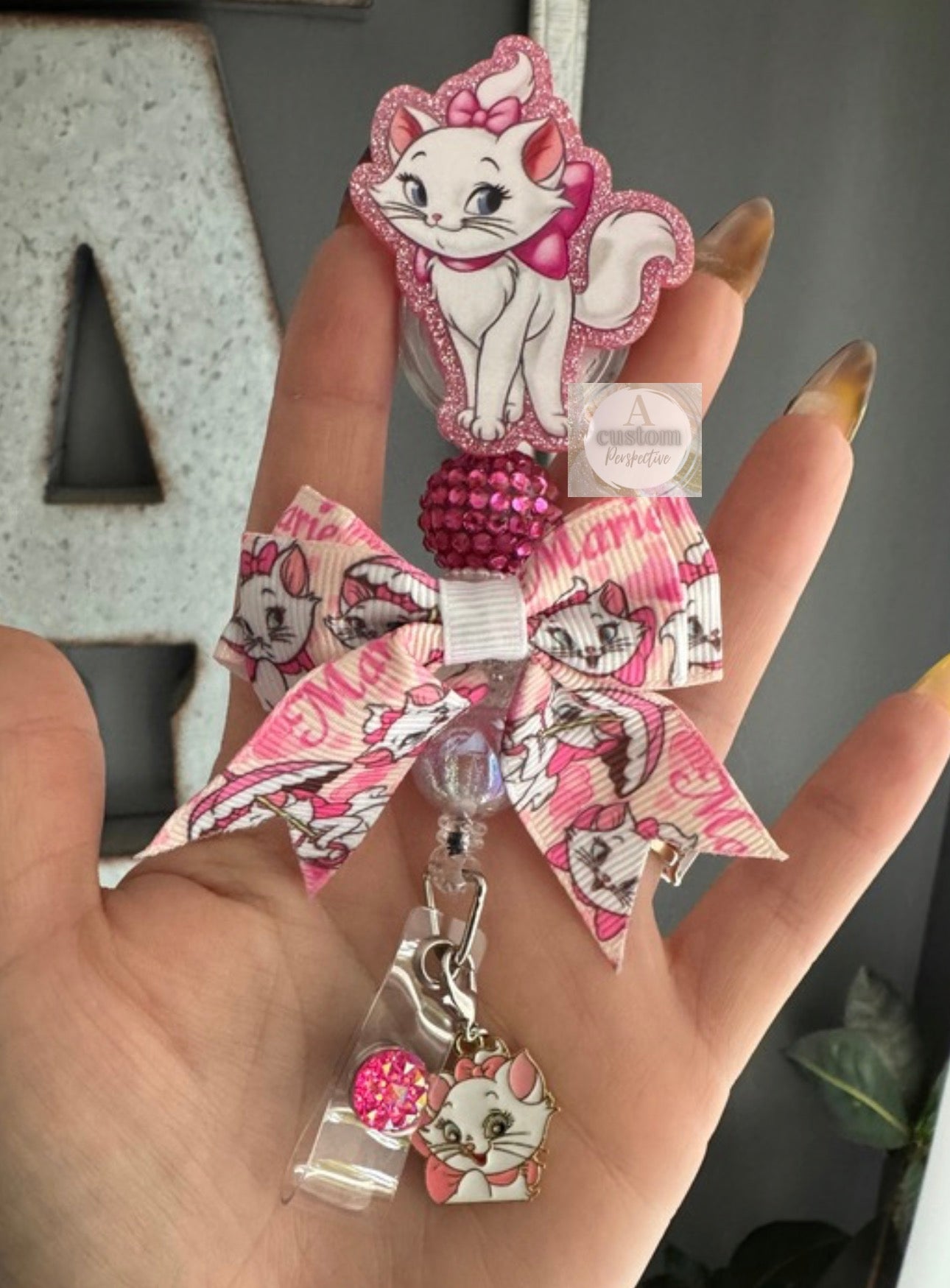 Marie Cat badge reel