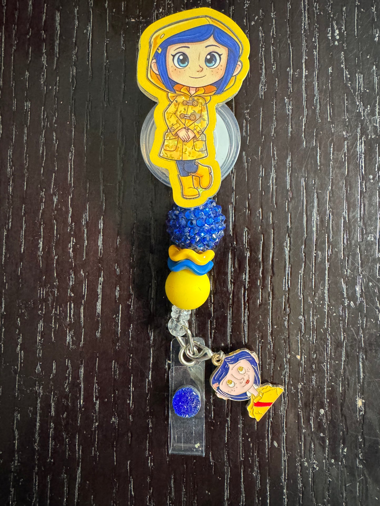 Coraline shaker badge reel
