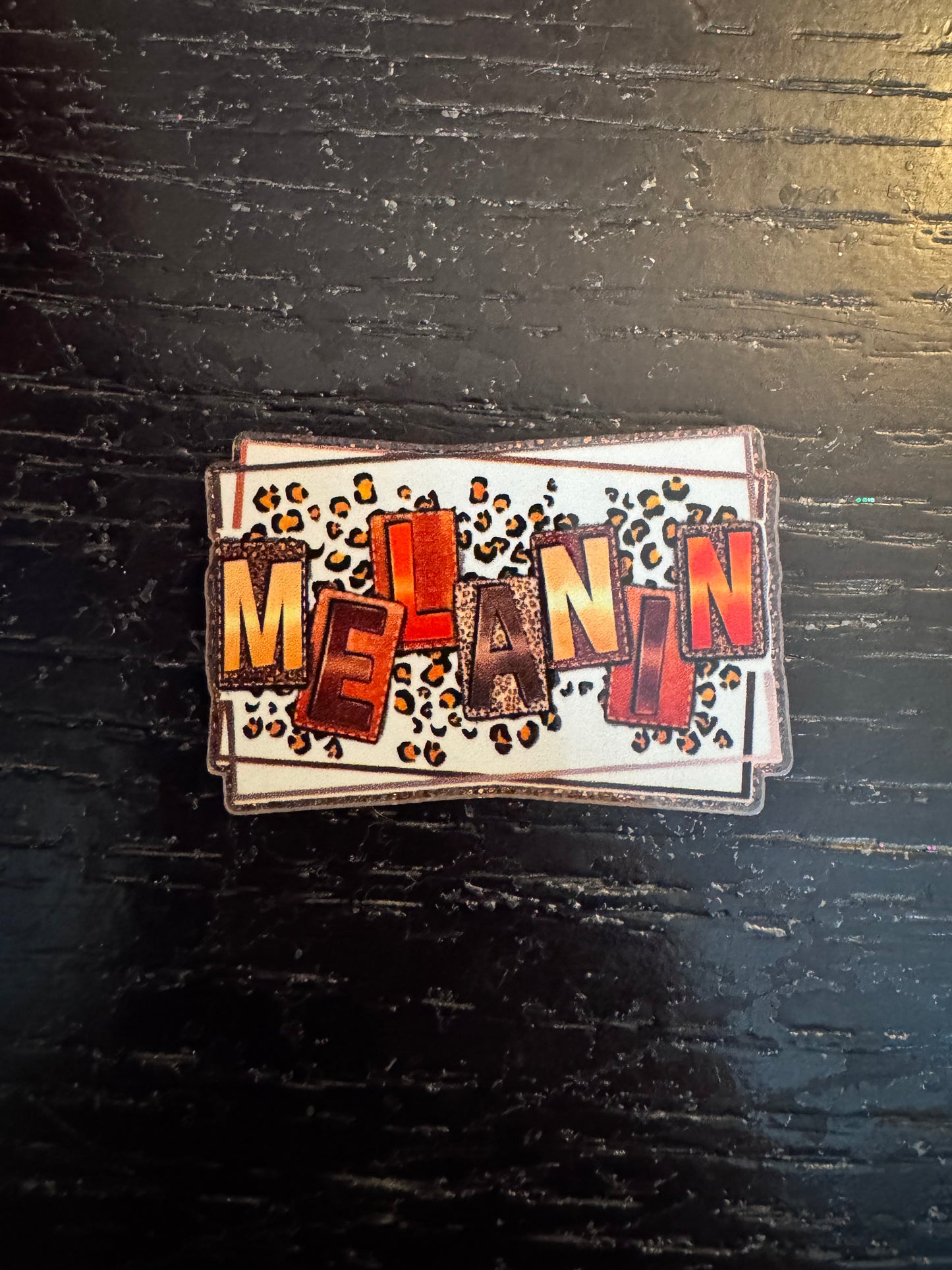 Melanin badge reel