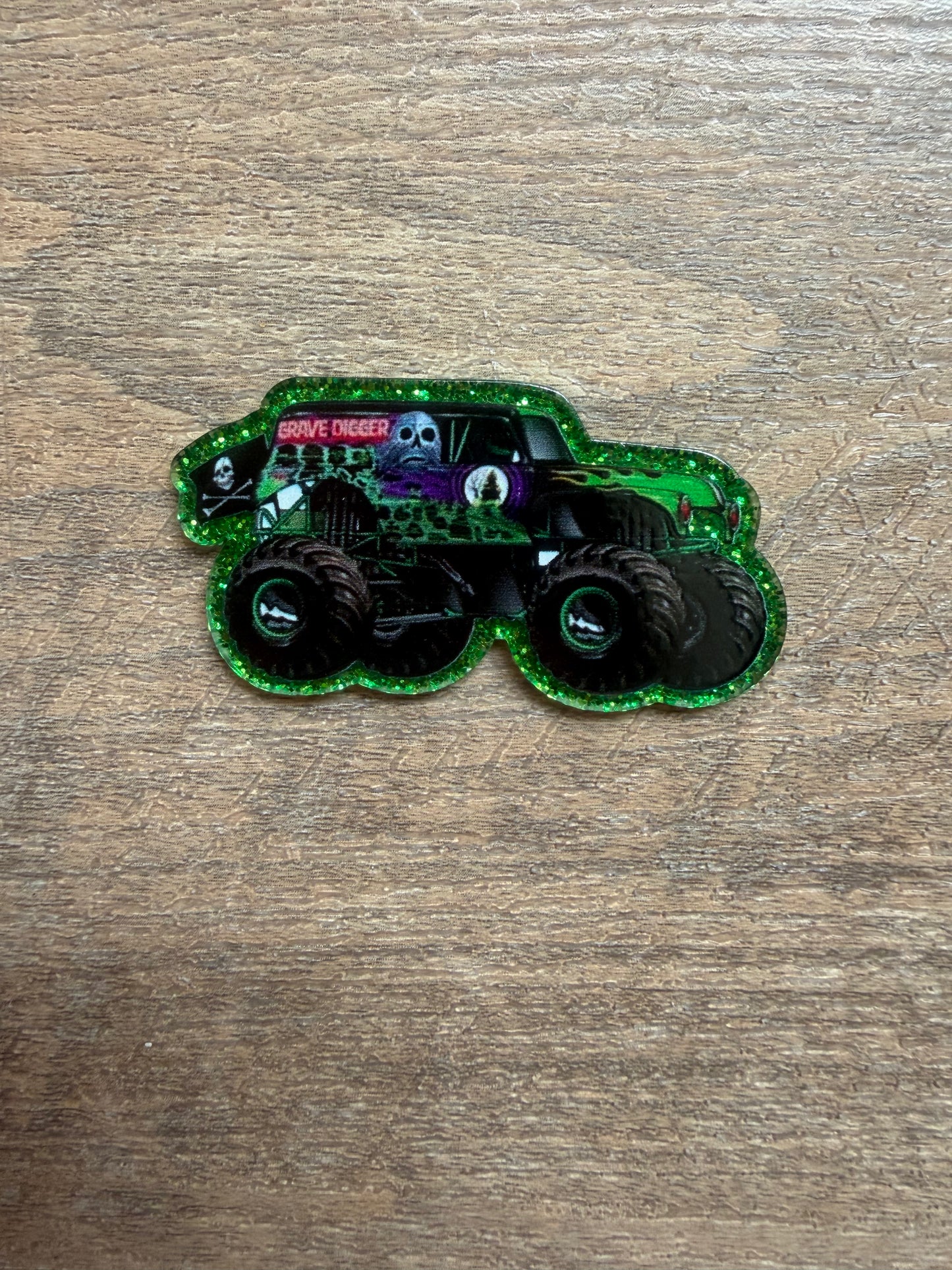 Grave Digger monster truck badge reel