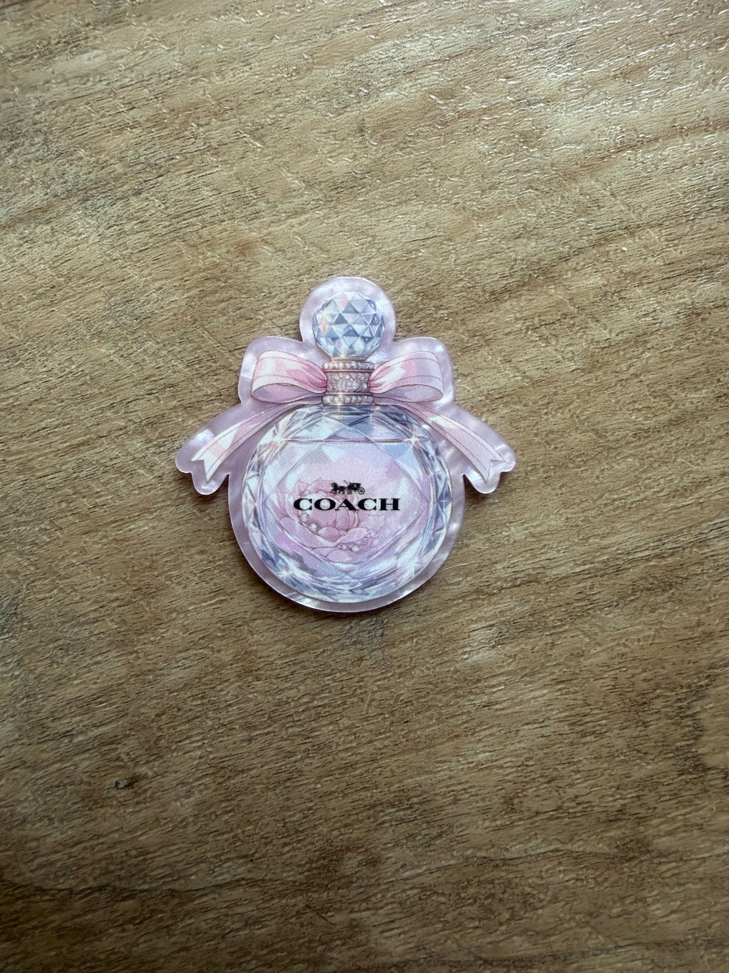 Coach badge reel