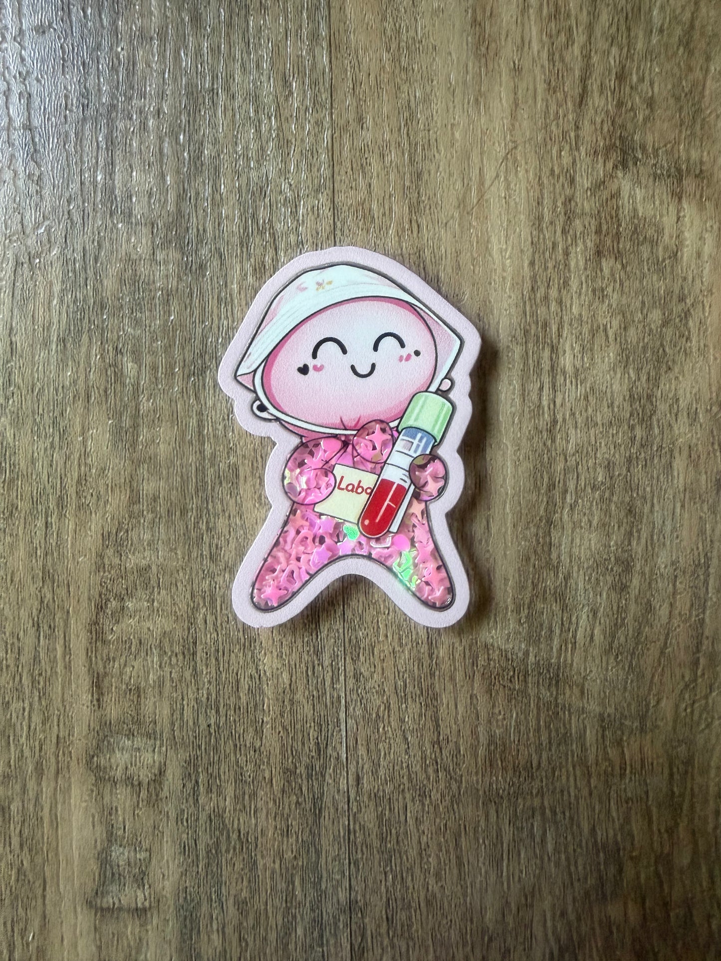 Glove baby shaker badge reel