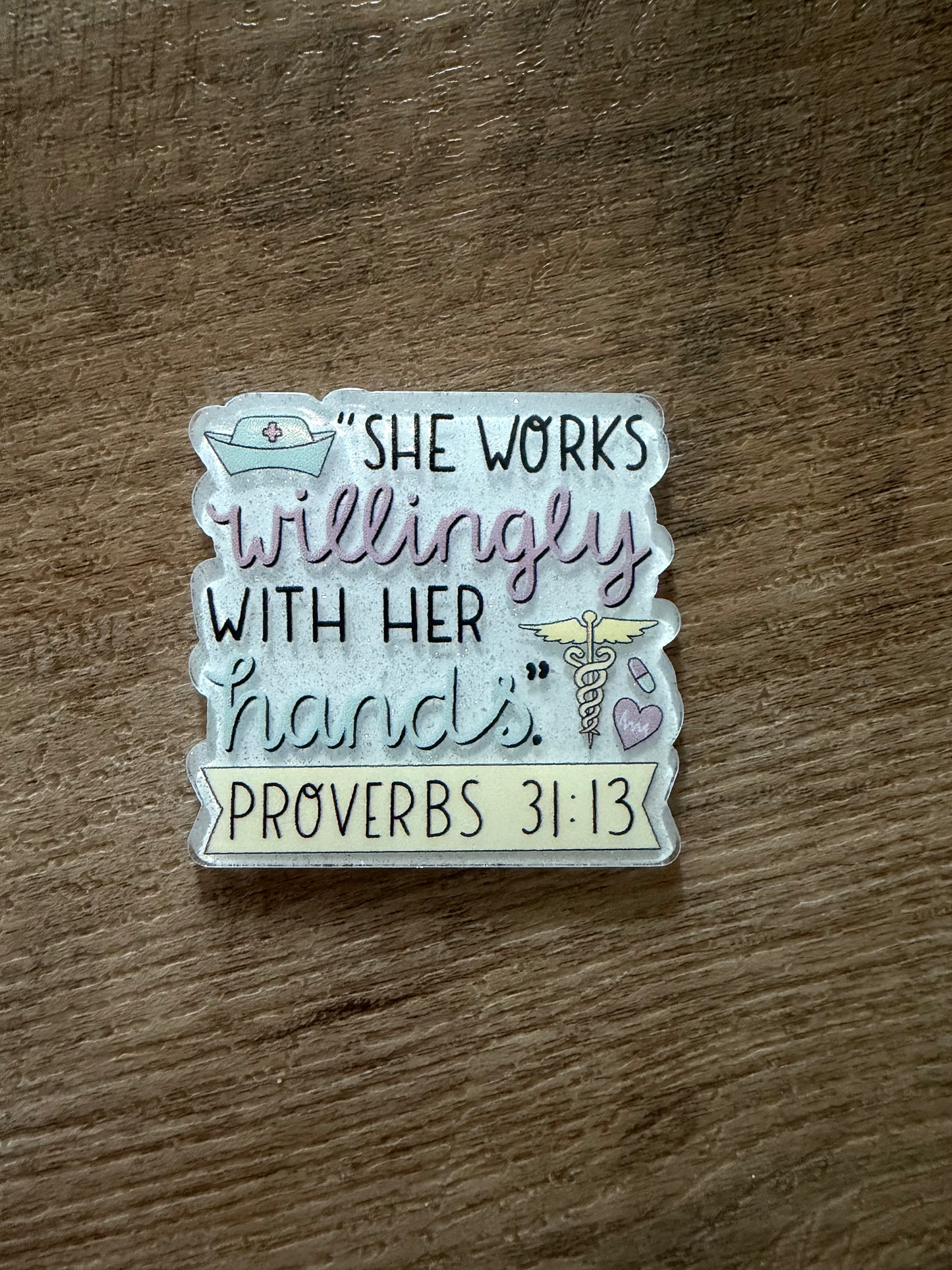 She works willingly with her hands badge reel