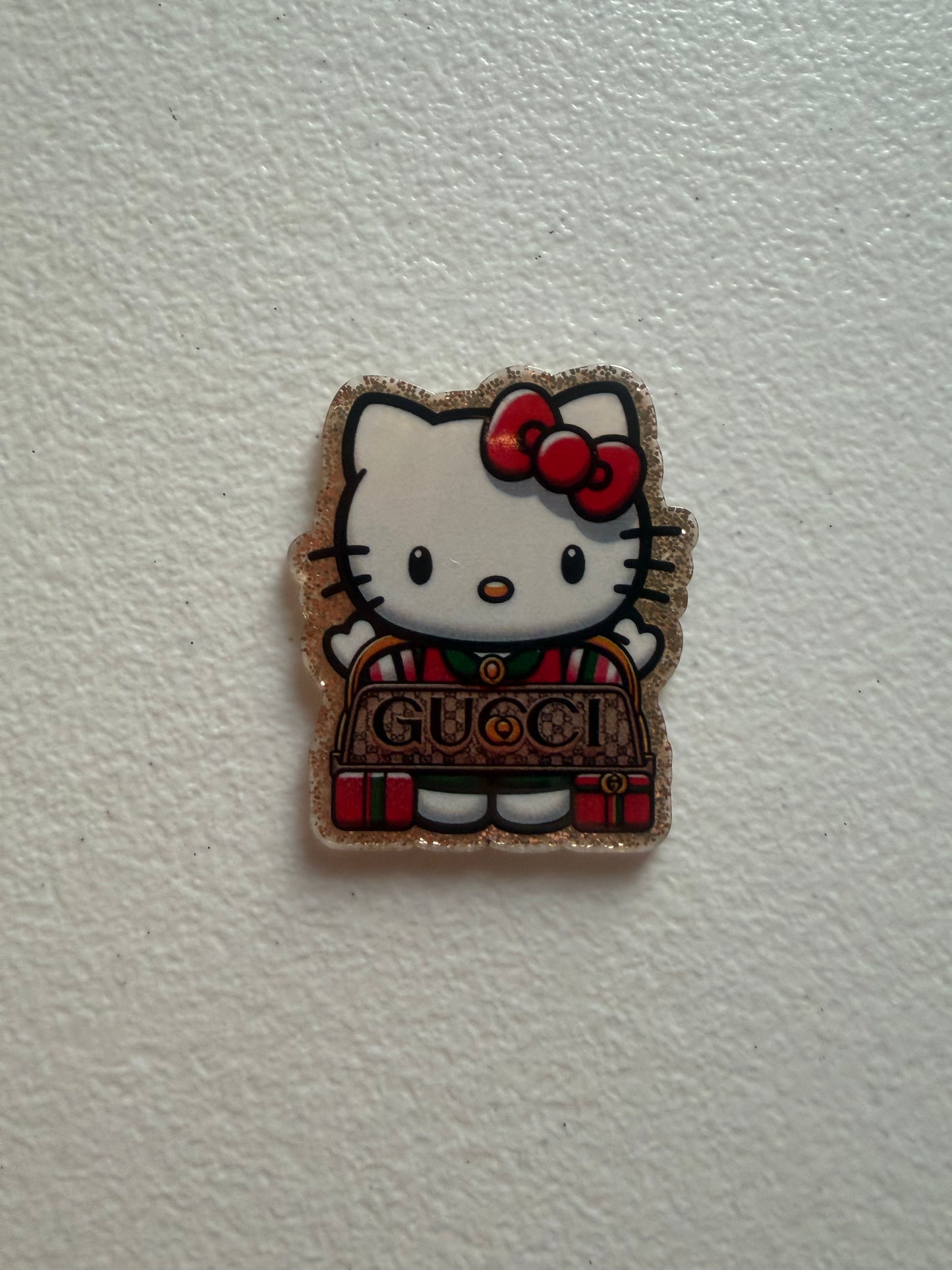 Hello Kitty Gucci badge reel