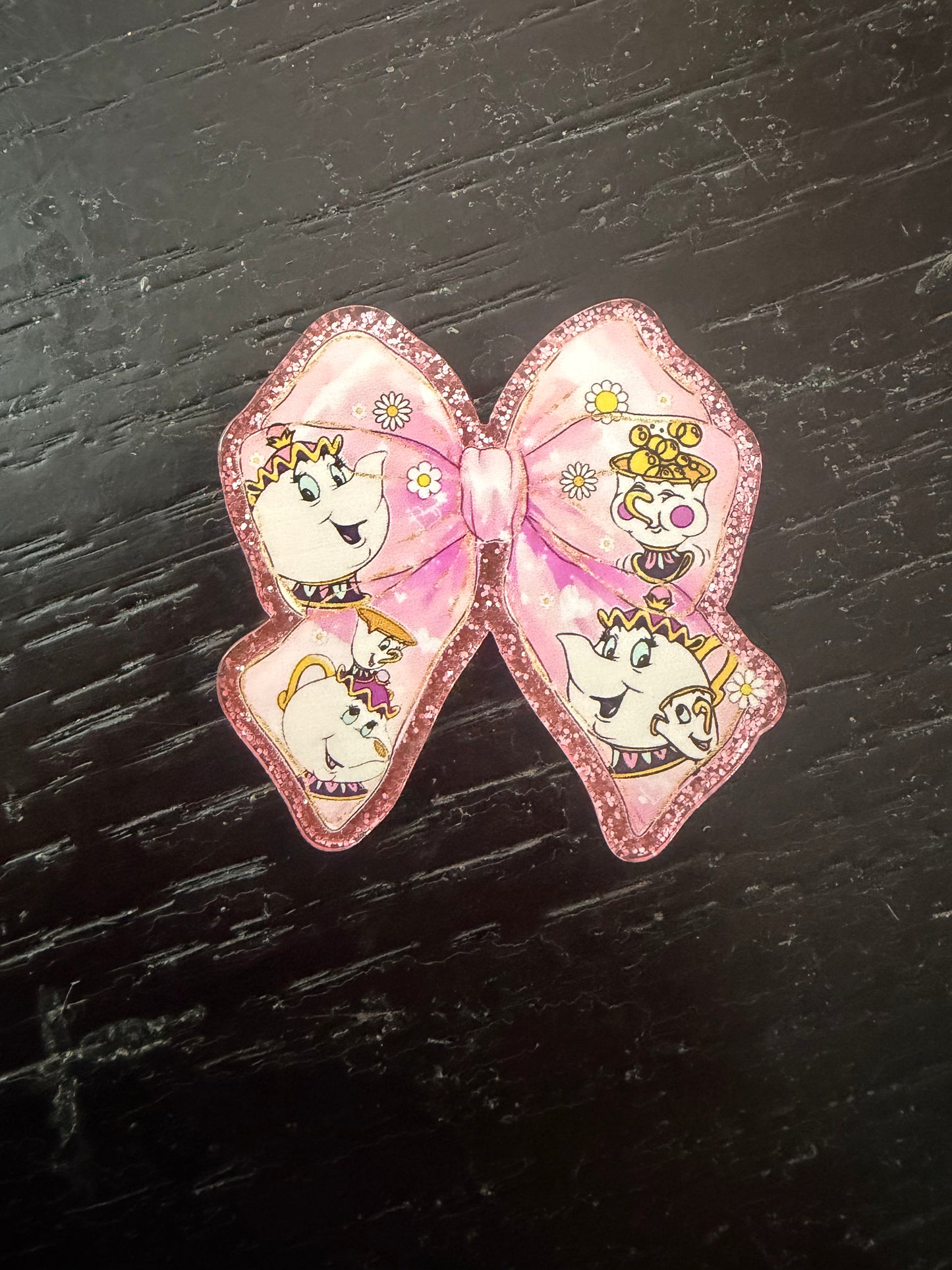 Mrs. Pots & Chip bow badge reel