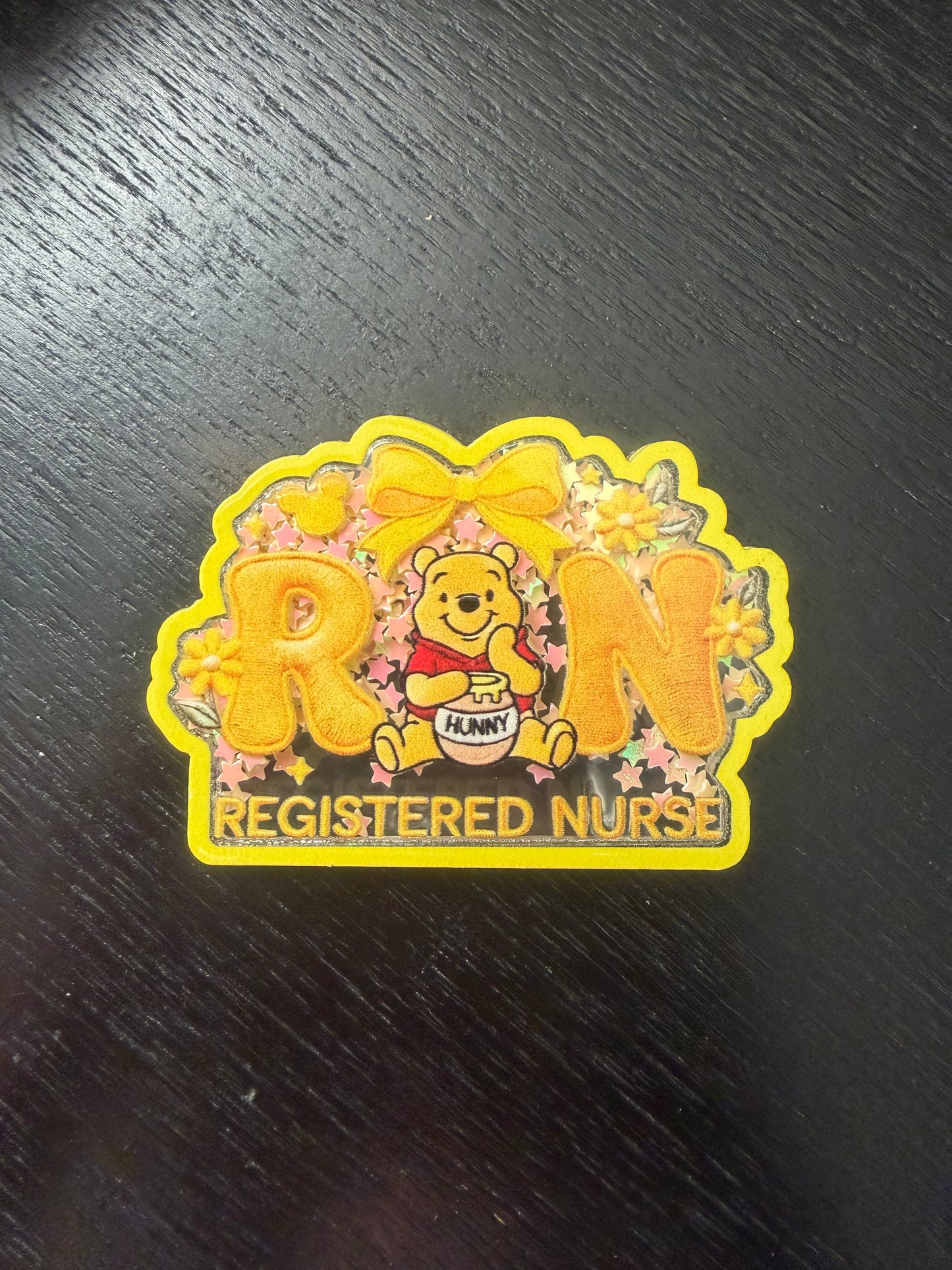 RN pooh shaker badge reel