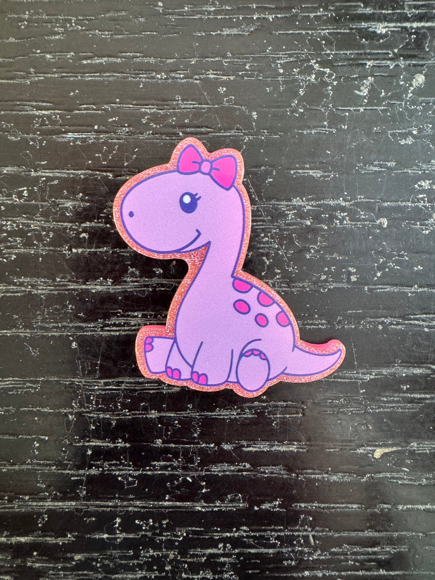 Dinosaur badge reel
