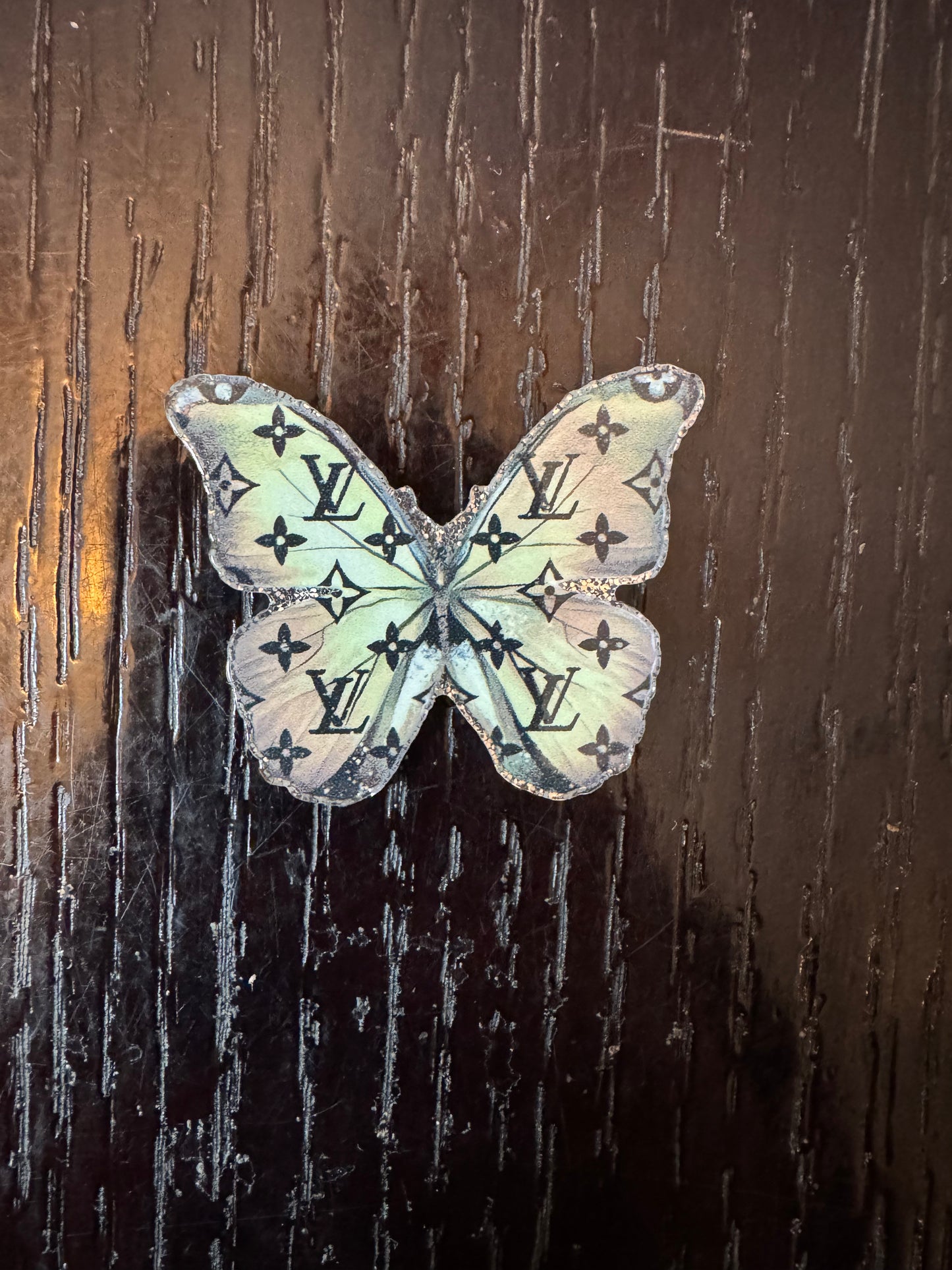 LV butterfly badge reels