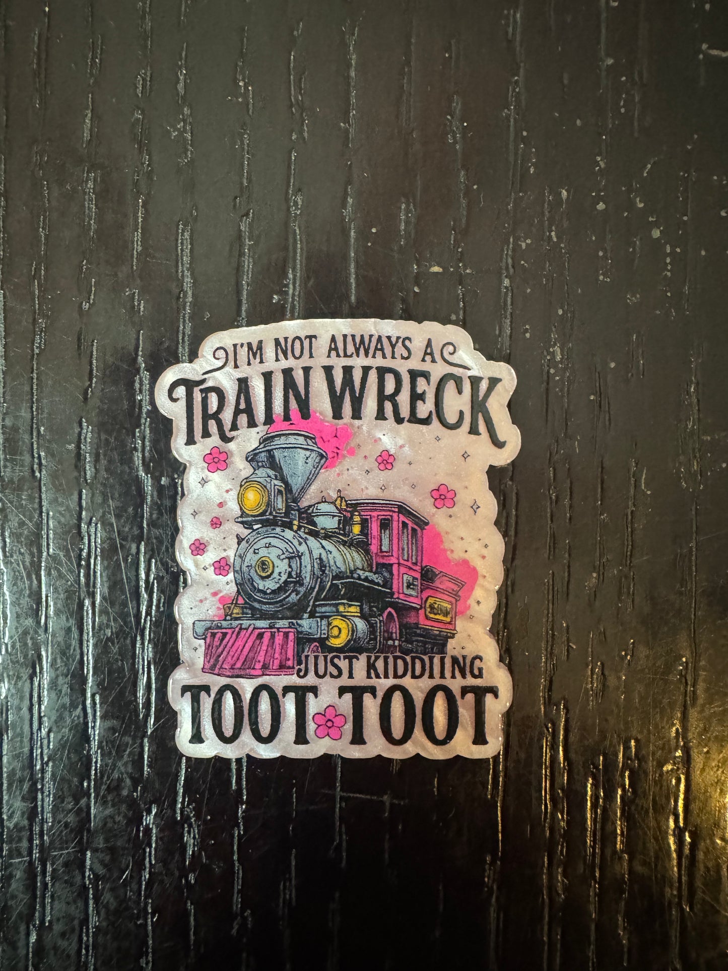 Train wreck badge reel