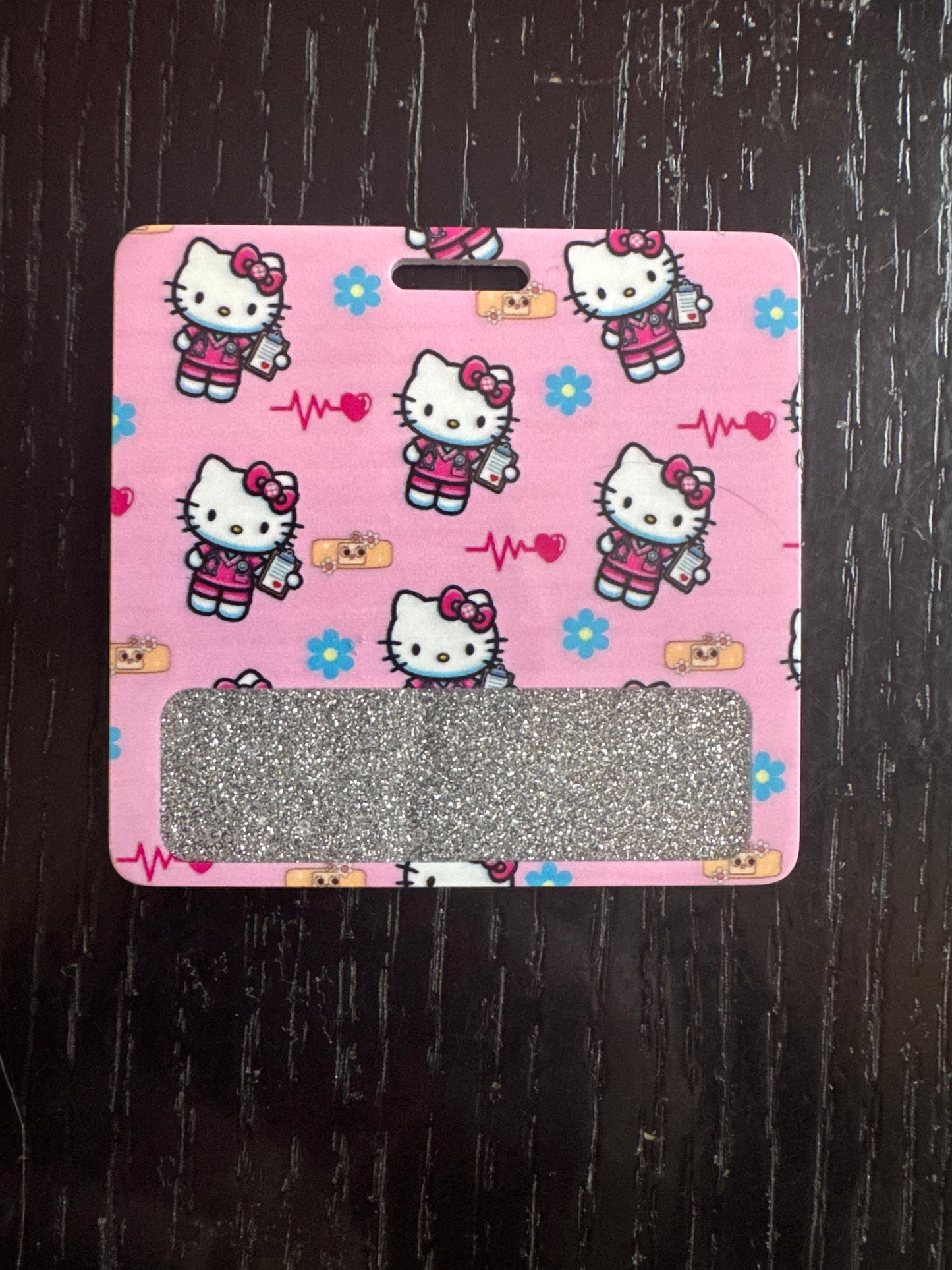 Hello kitty nurse badge buddy