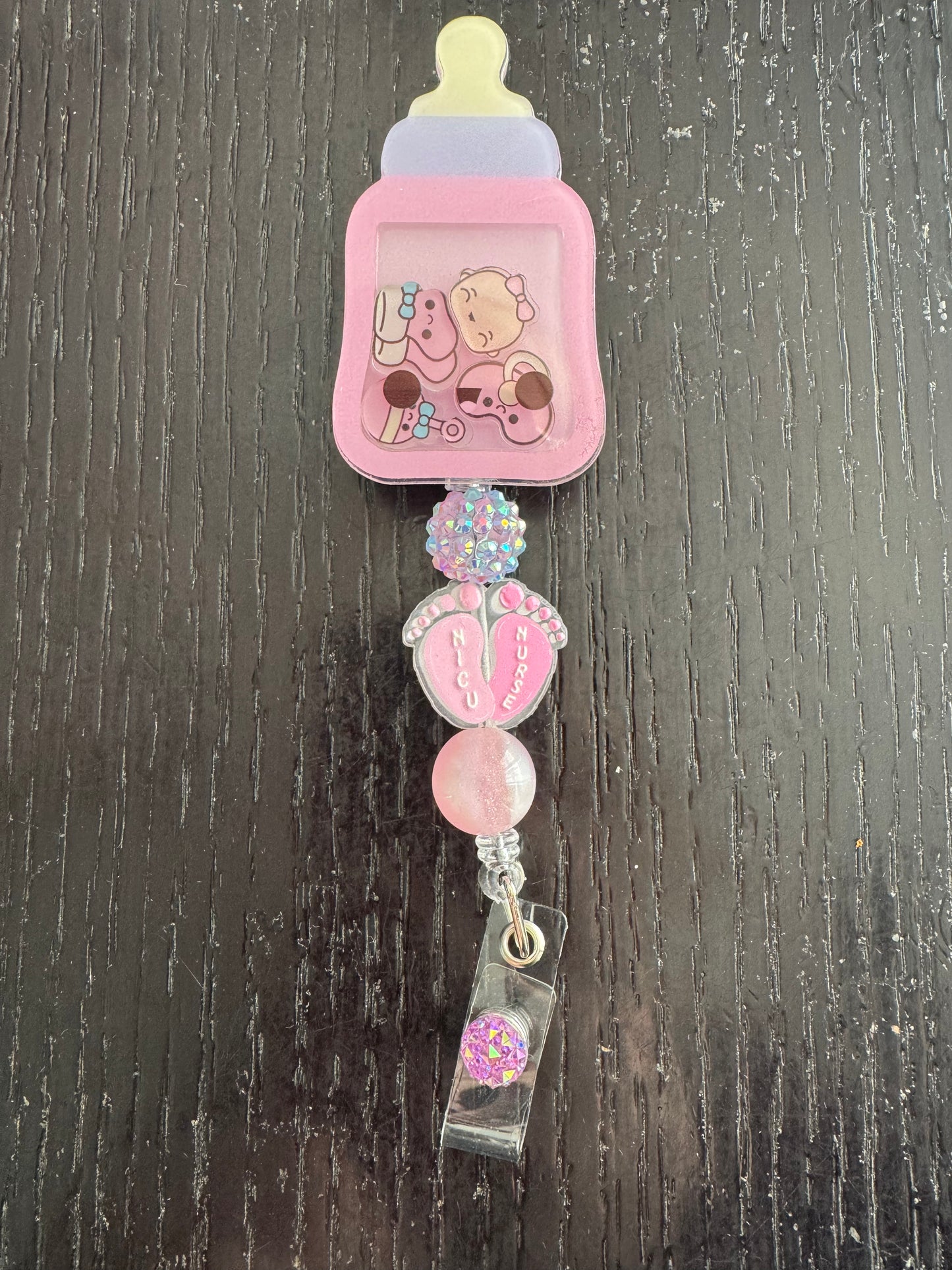 Baby bottle shaker badge reel