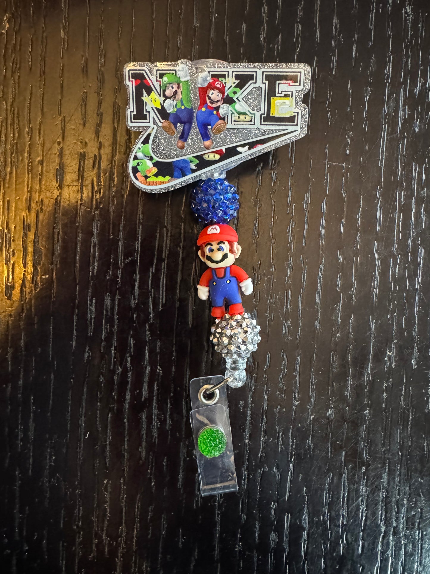 Super Mario Nike badge reel