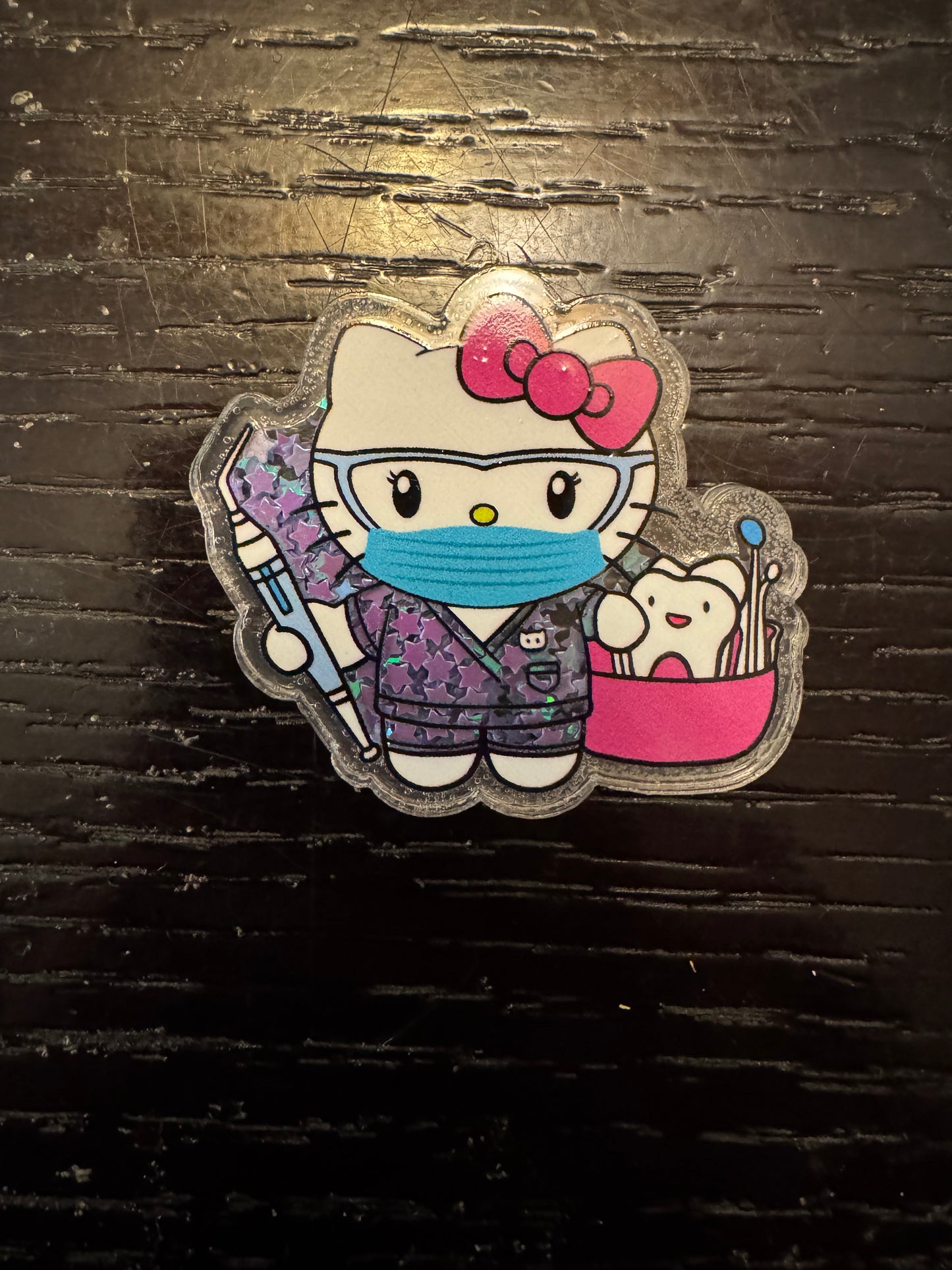 Hello Kitty dental shaker badge reel
