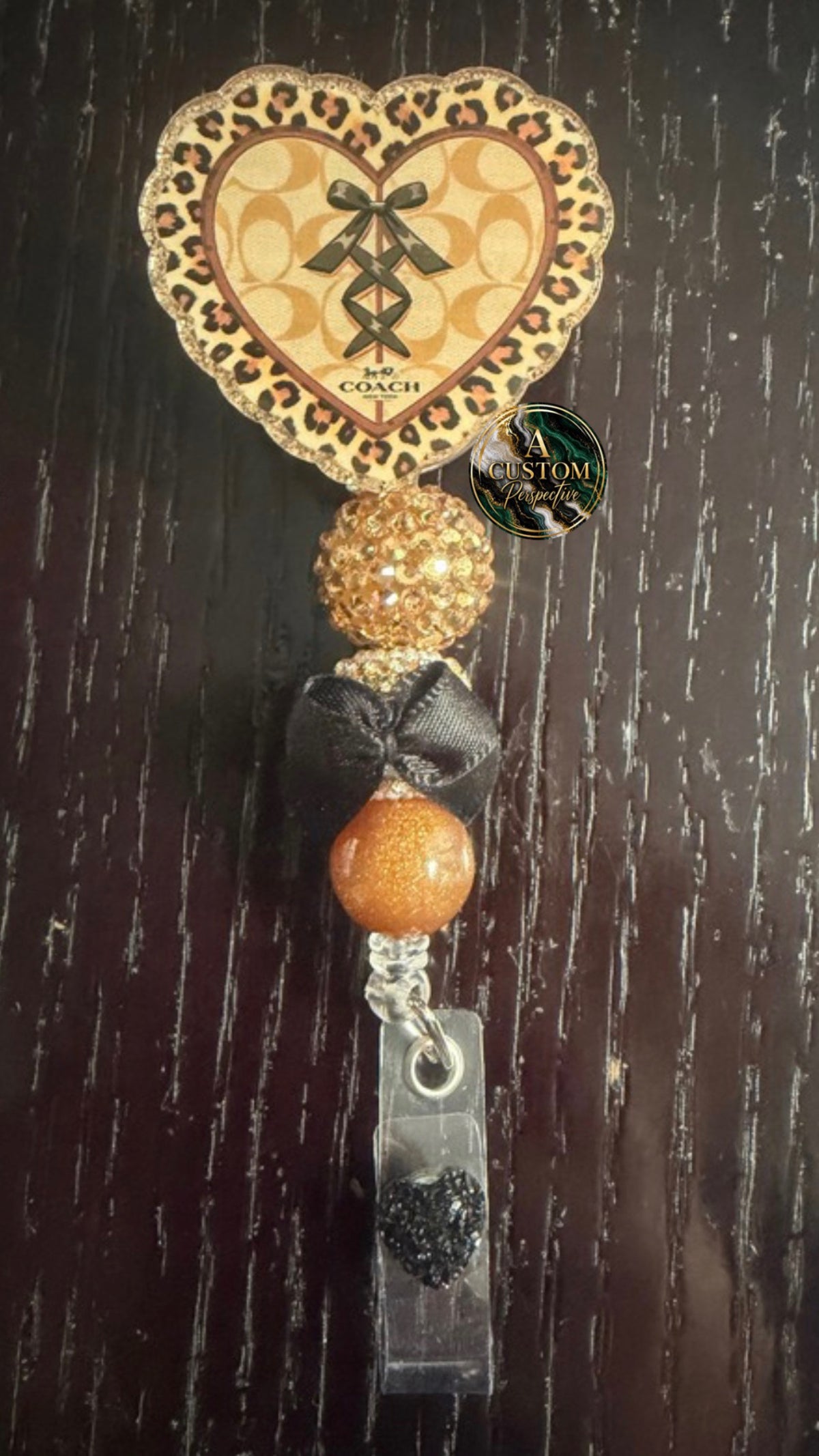 Coach badge reel