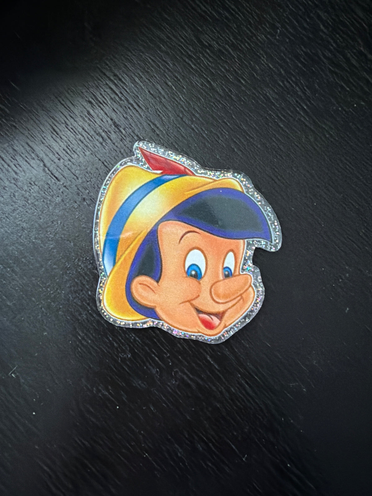 Pinocchio badge reel