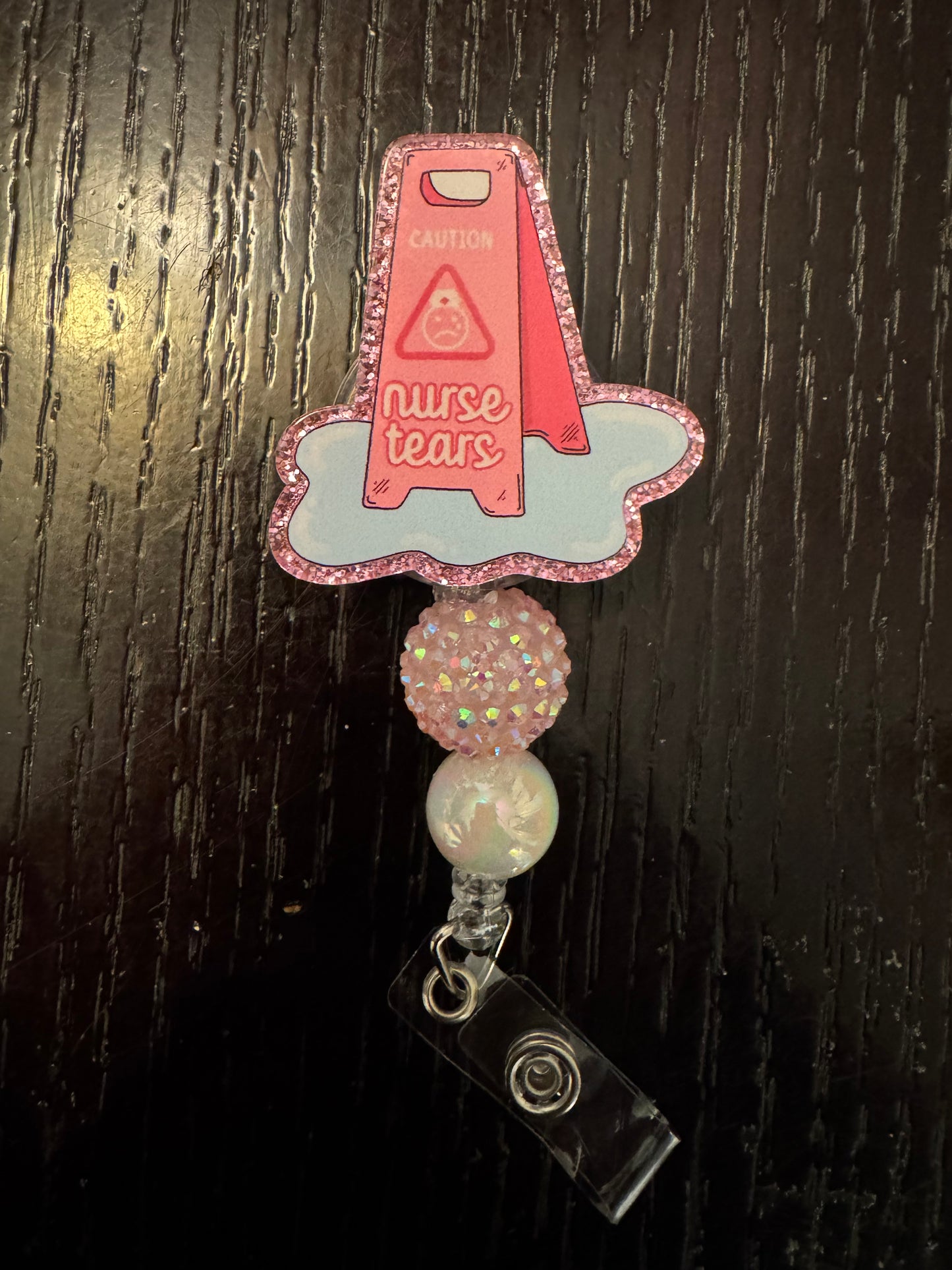 Nurse tears badge reel