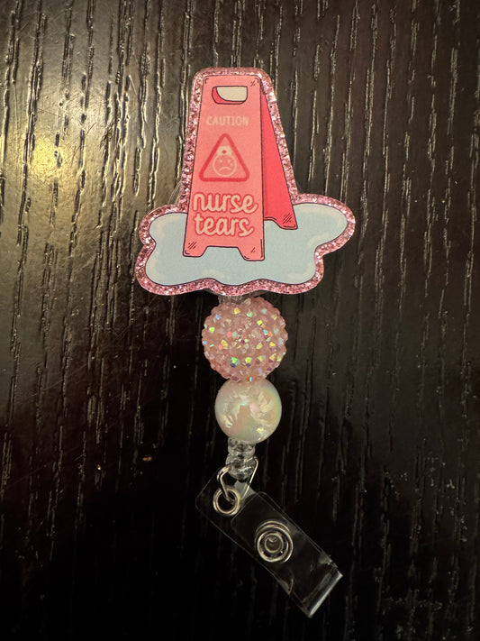 Nurse tears badge reel