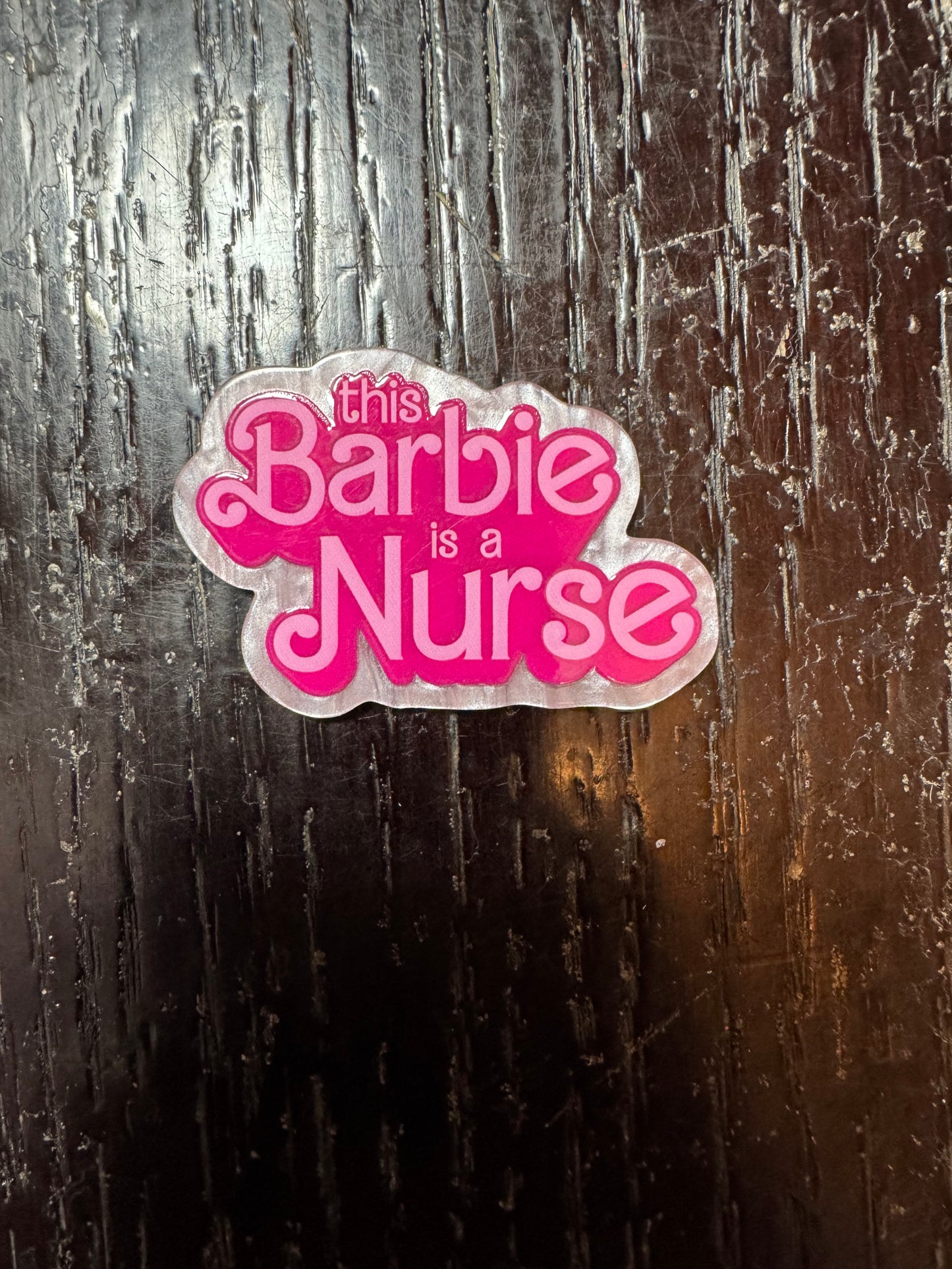 This Barbie is a nurse badge reel