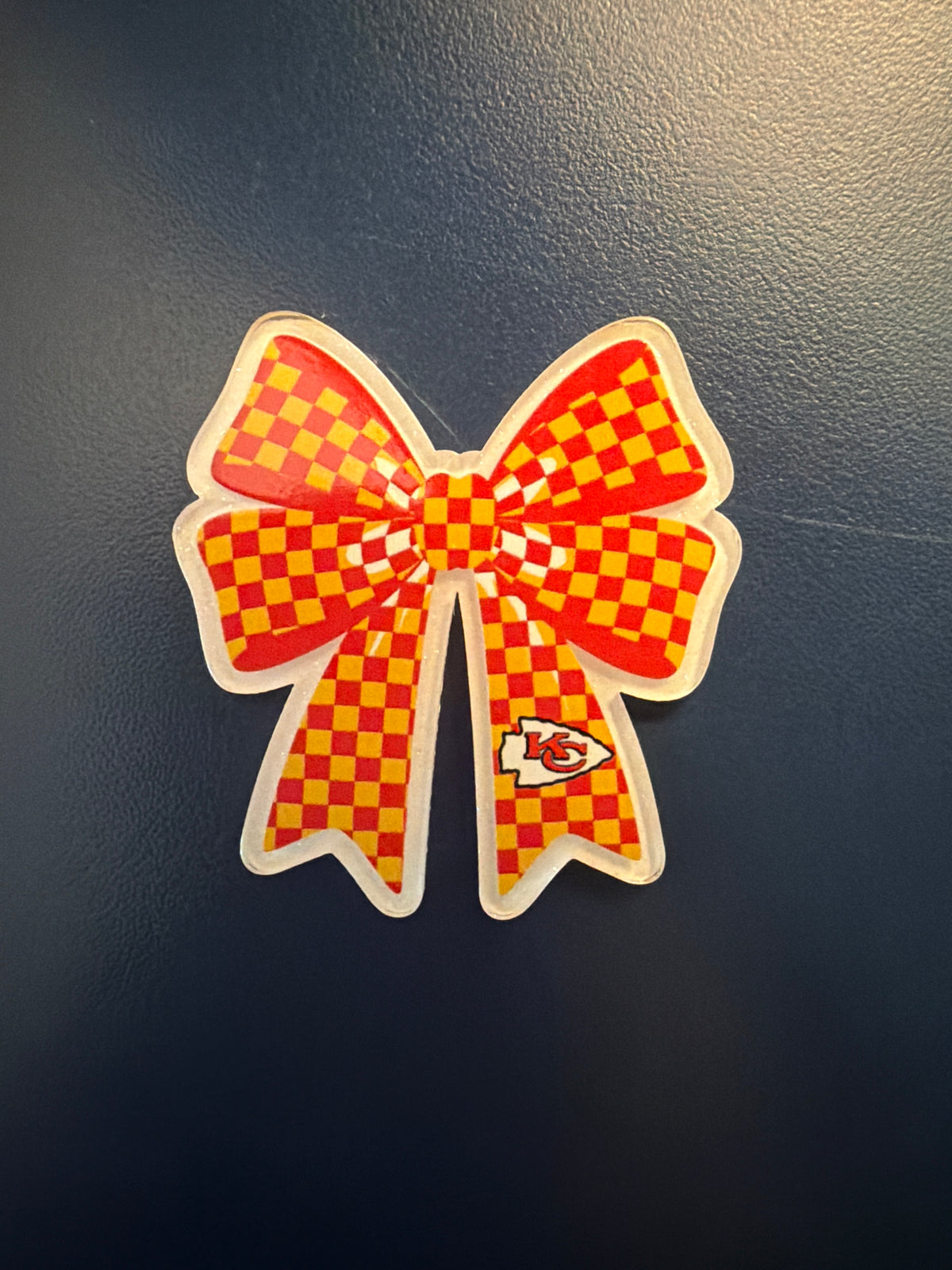 3. ADD A BOW FOOTBALL CHARM