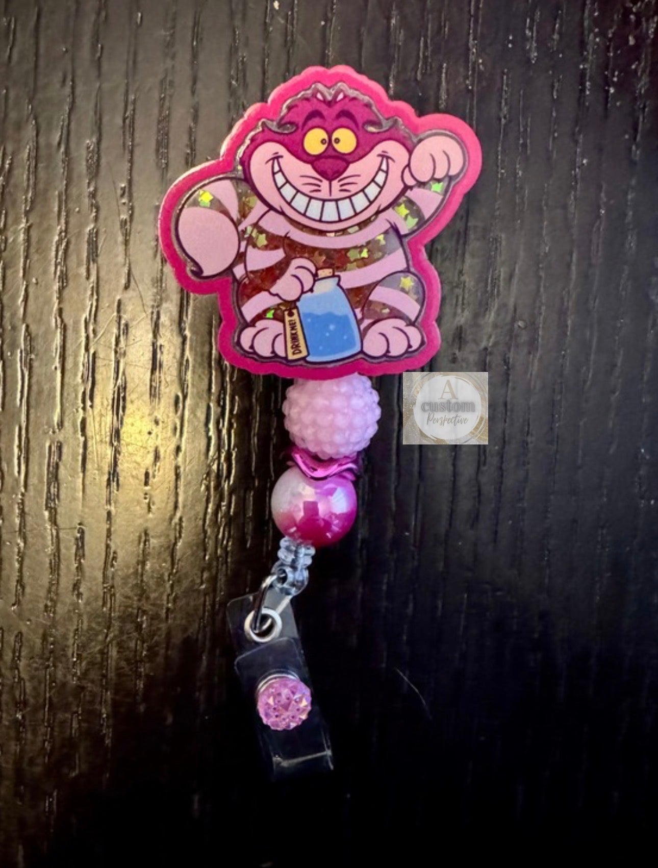 Cheshire Cat shaker badge reel