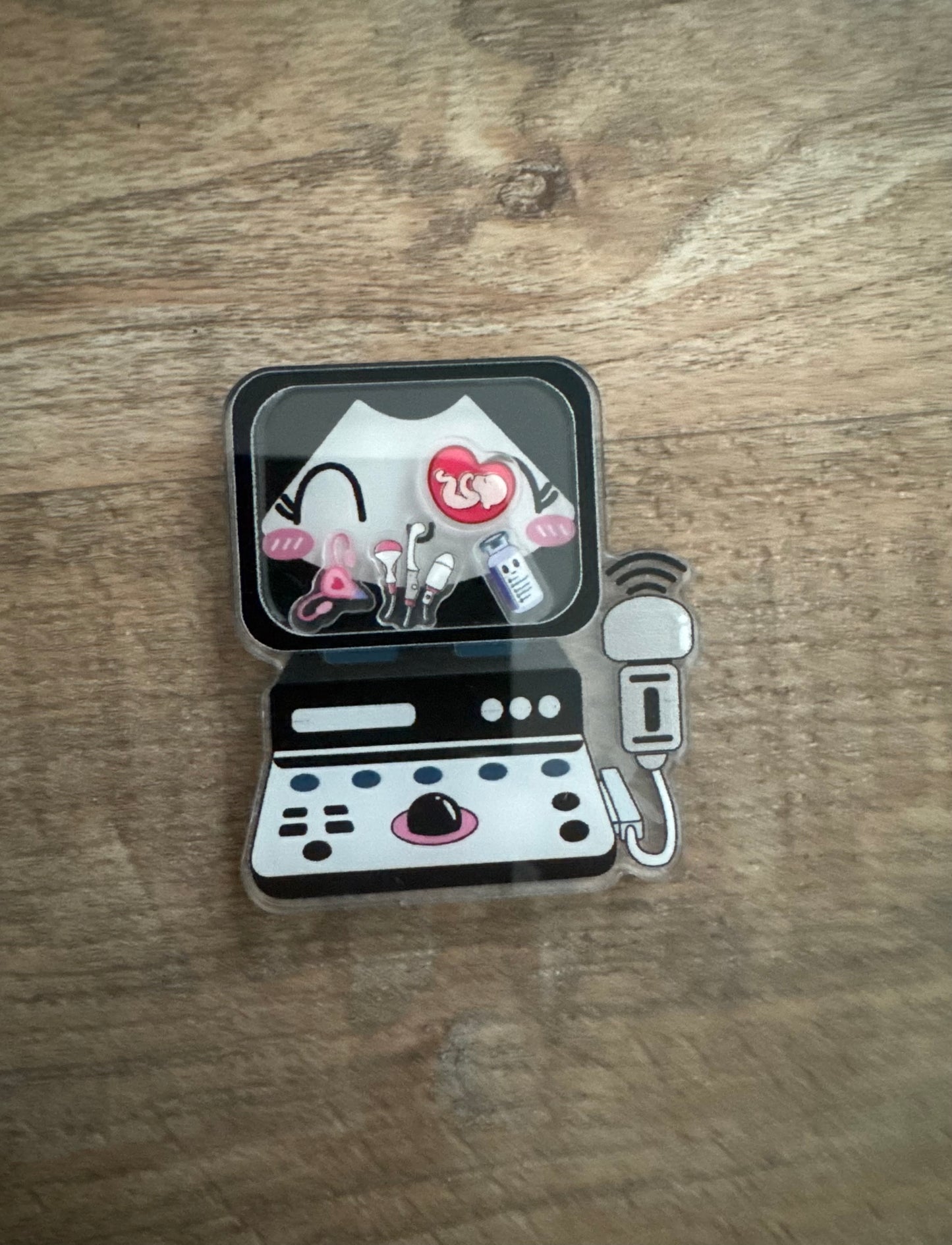 Ultrasound shaker badge reel