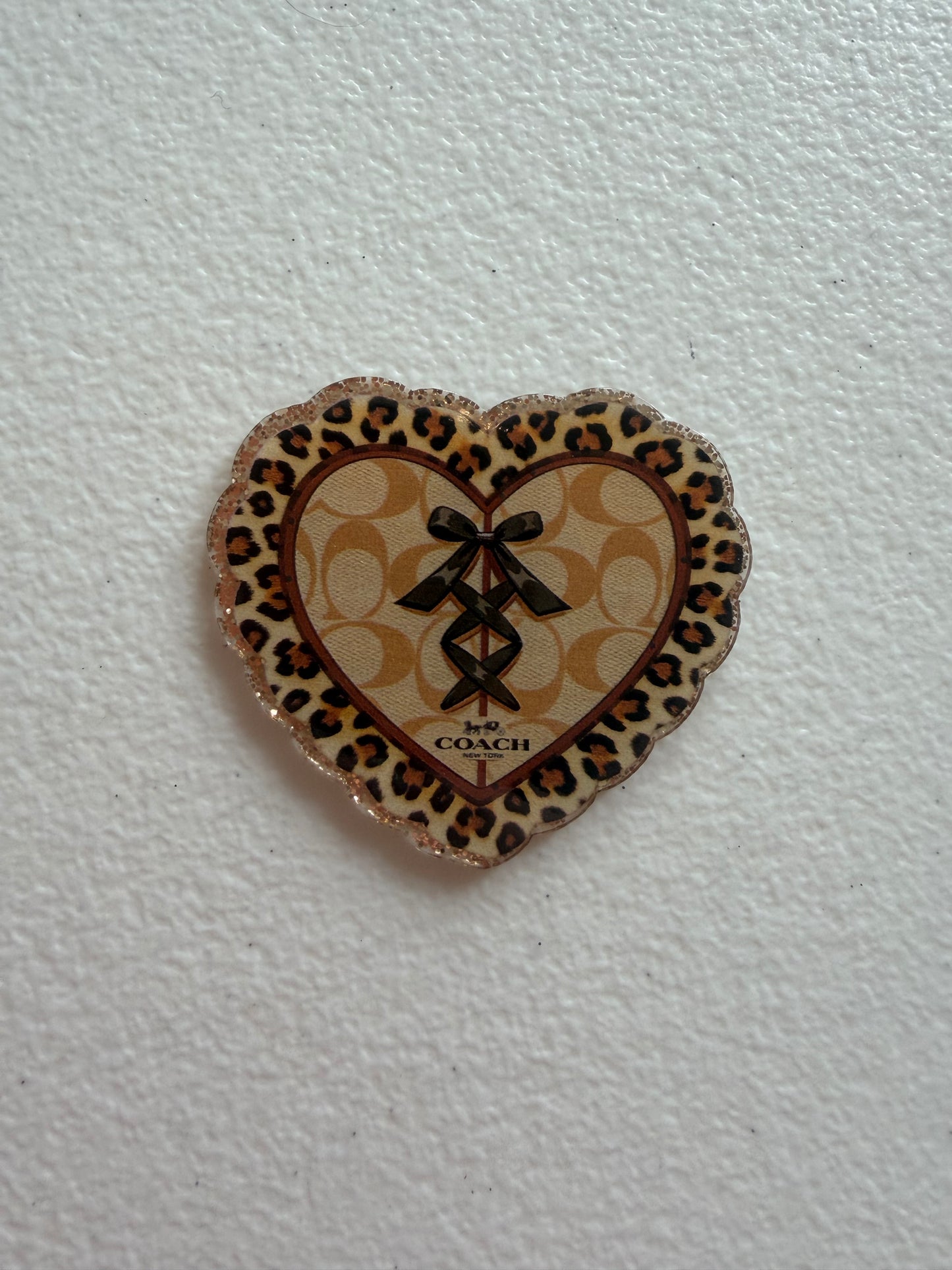 Coach badge reel
