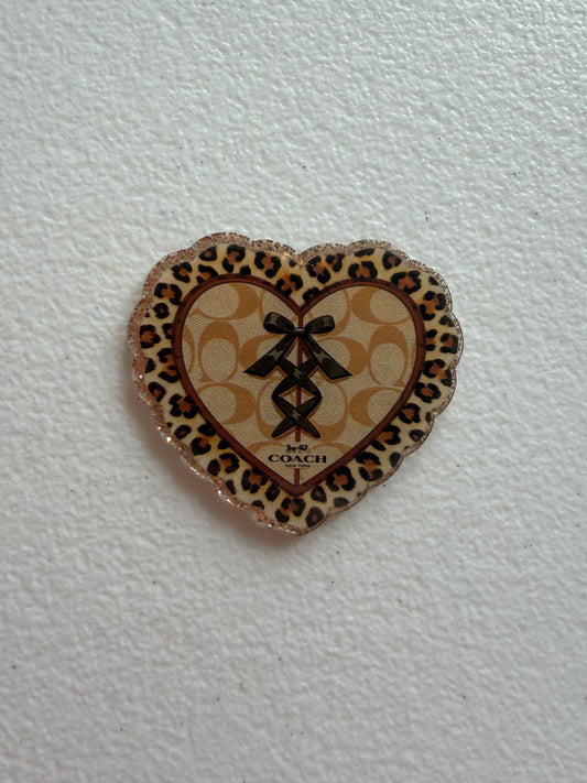 Coach badge reel