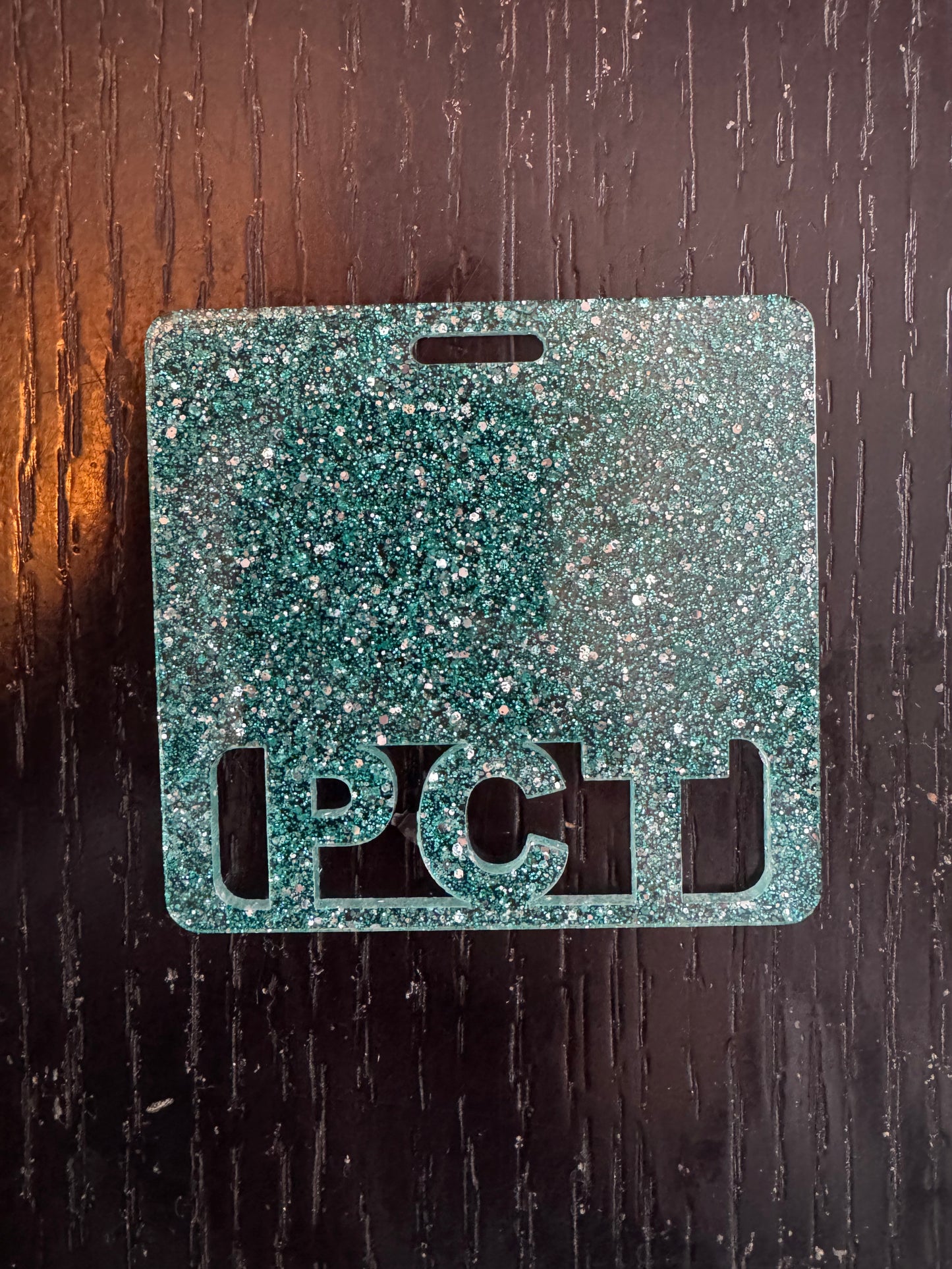 PCT teal glitter badge buddy