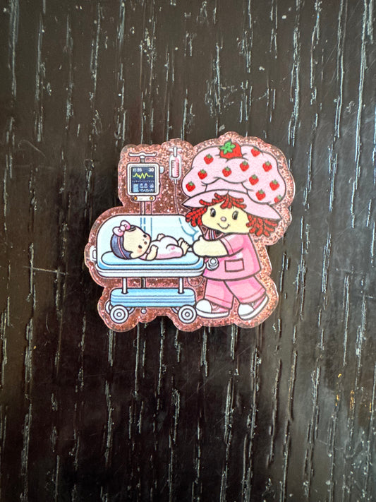 Strawberry shortcake baby badge reel