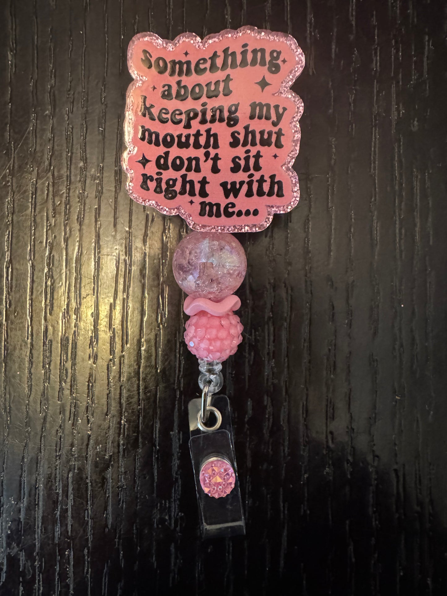 Something about keeping my mouth shut badge reel
