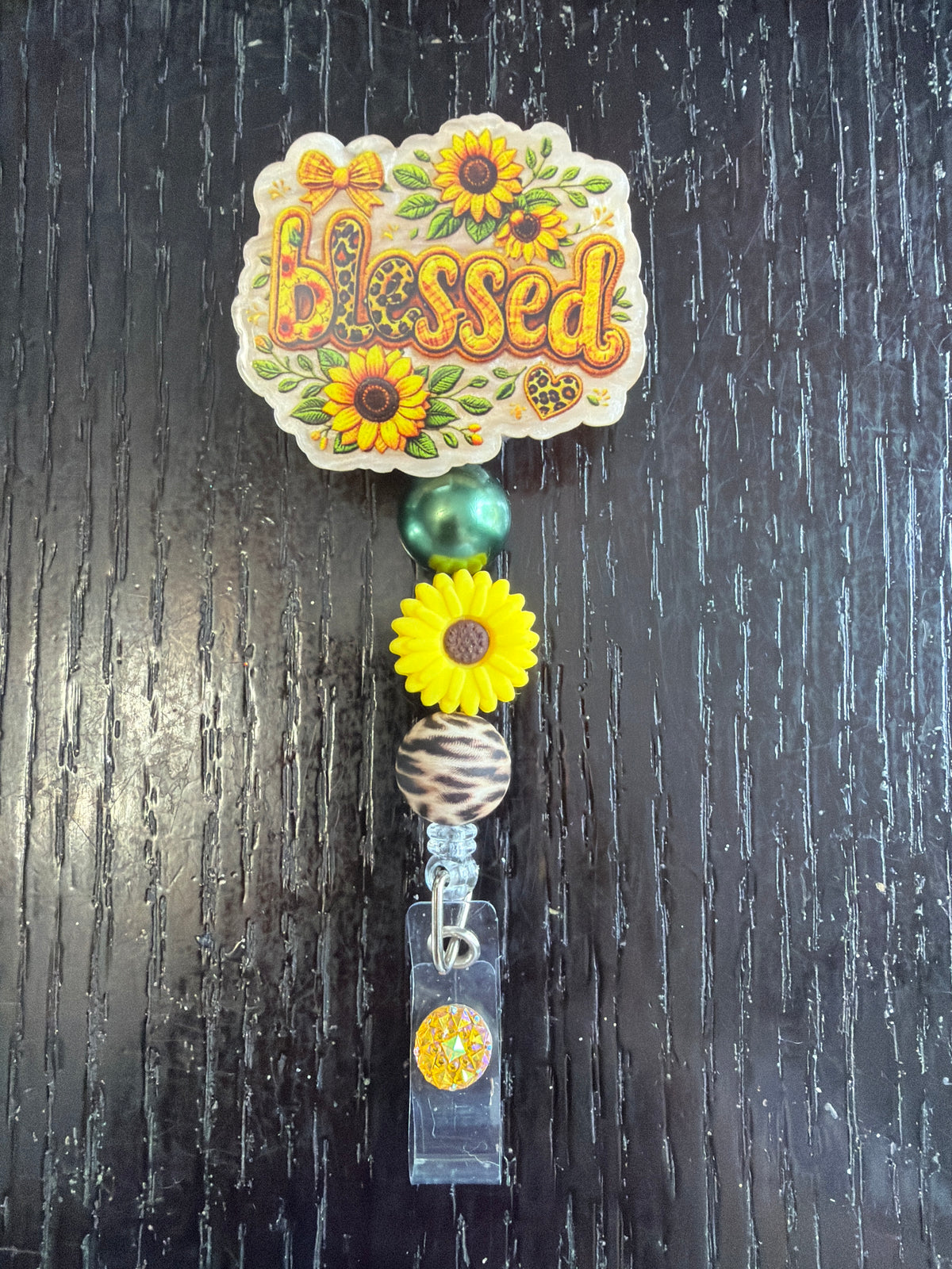 Blessed badge reel