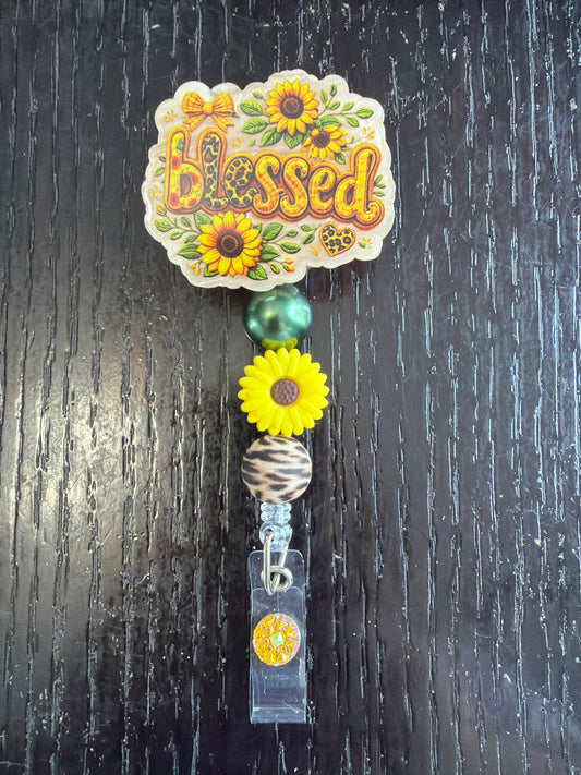 Blessed badge reel
