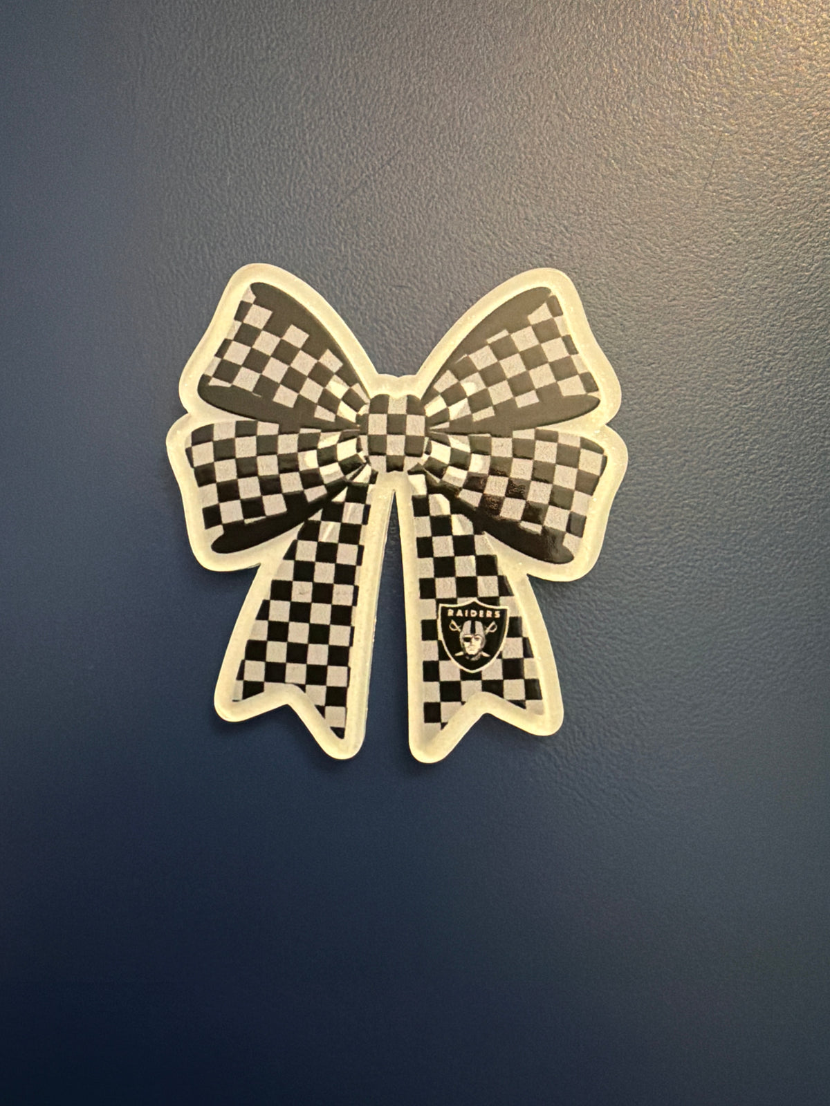 3. ADD A BOW FOOTBALL CHARM