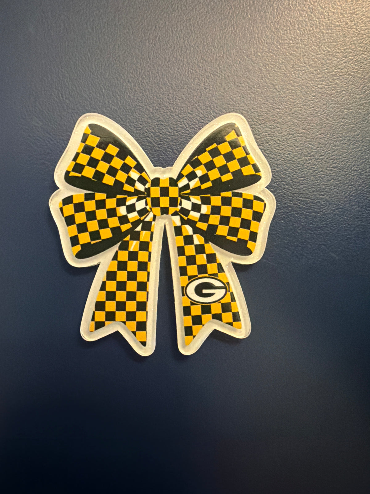 3. ADD A BOW FOOTBALL CHARM