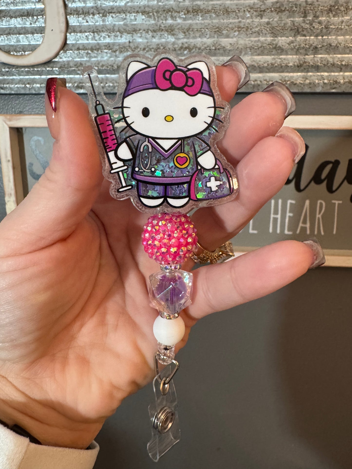 Hello kitty nurse shaker badge reel