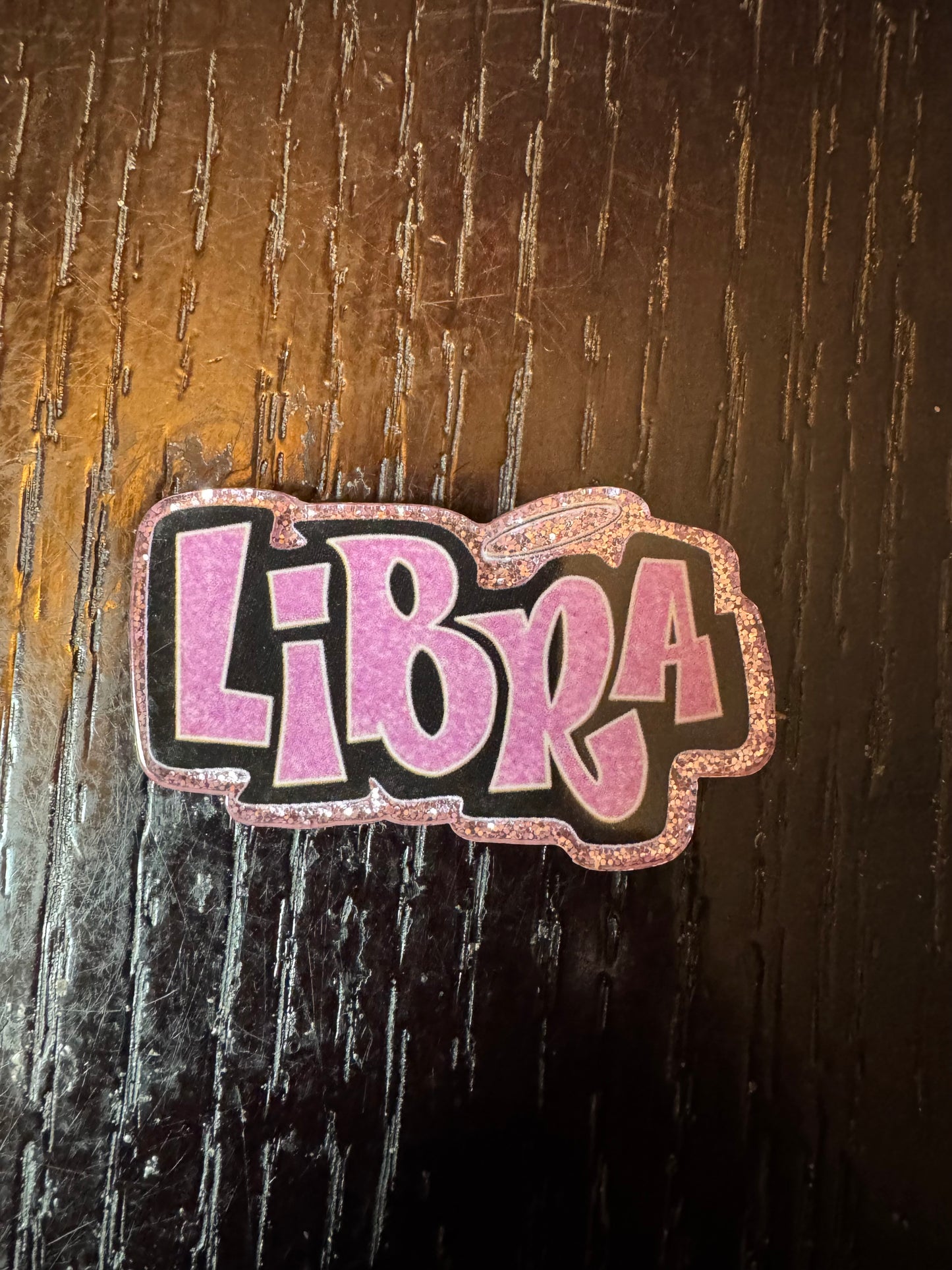 Libra badge reel