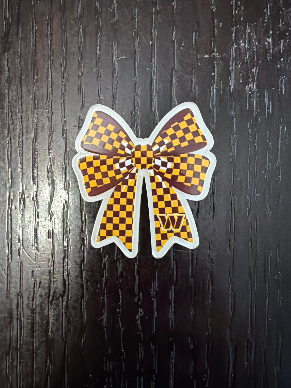 3. ADD A BOW FOOTBALL CHARM