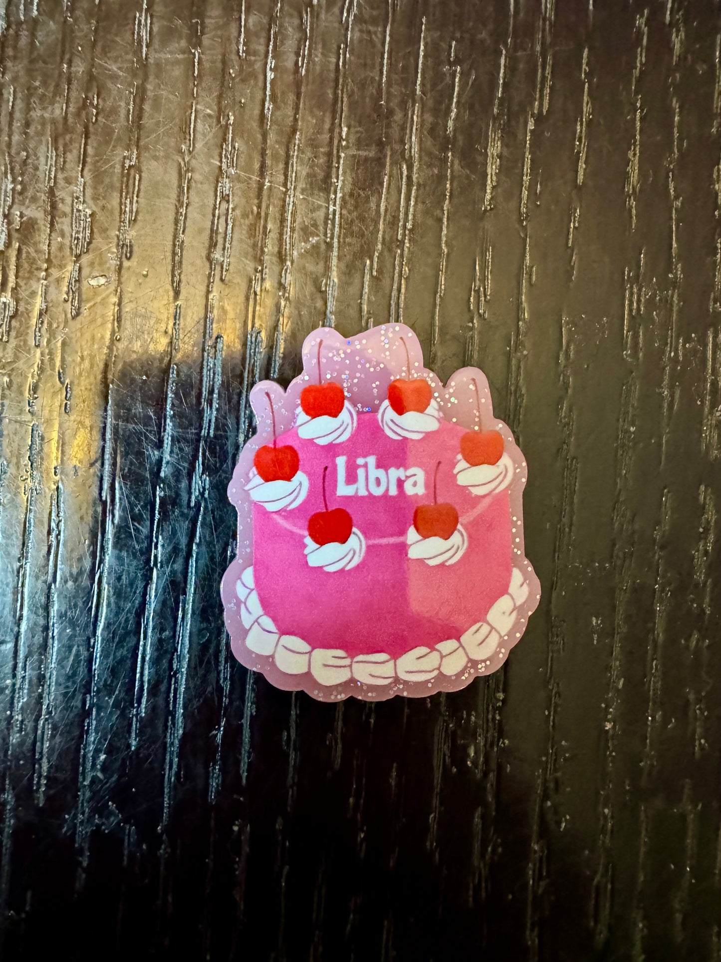 Libra badge reel