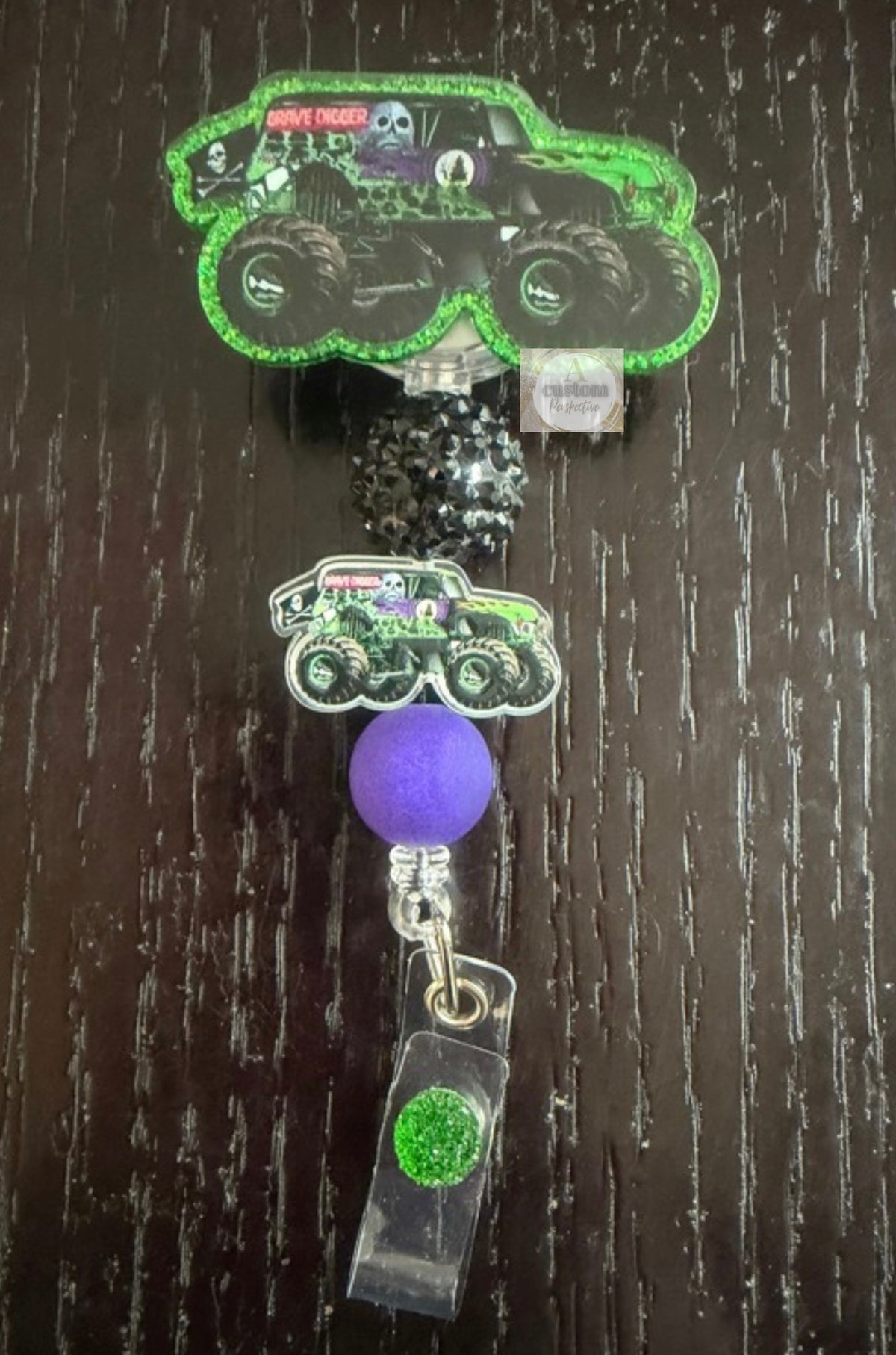 Grave Digger monster truck badge reel