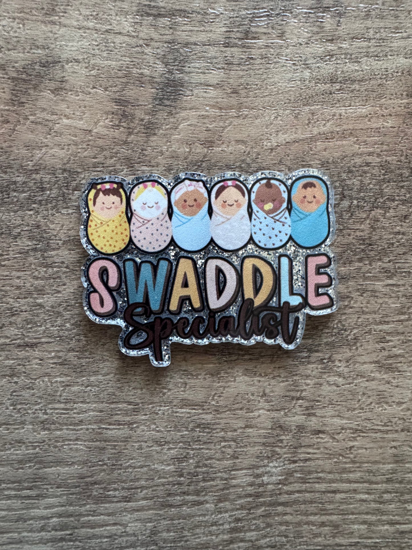 Swaddle specialist badge reel