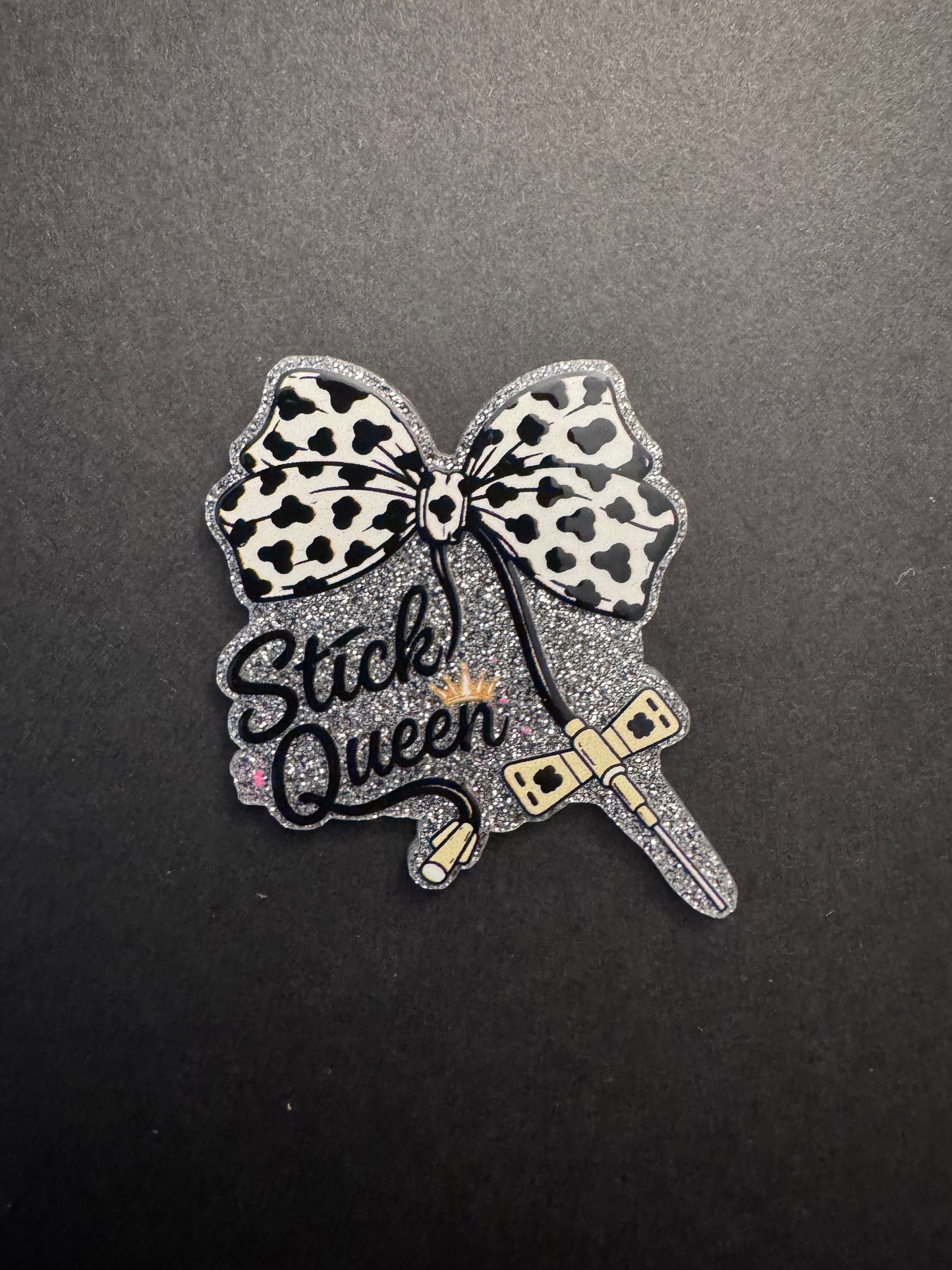 Stick queen badge reel
