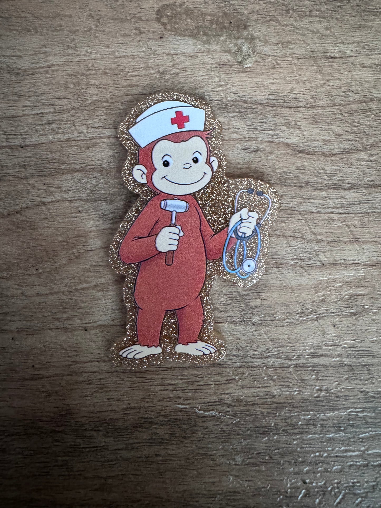 Curious George badge reel
